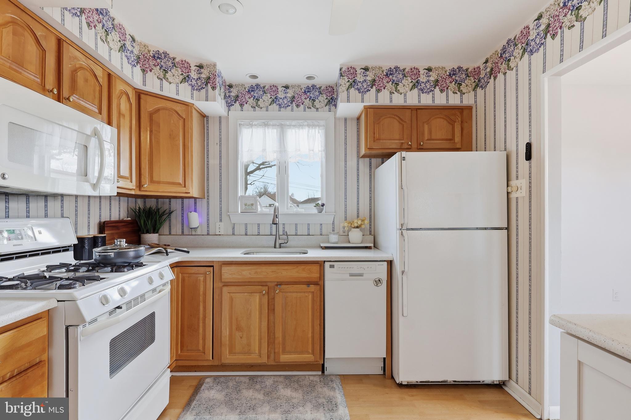327 South Norristown Road Warminster, PA 18974 - Photo 10 of 32 a kitchen with a white cabinets stove and refrigerator