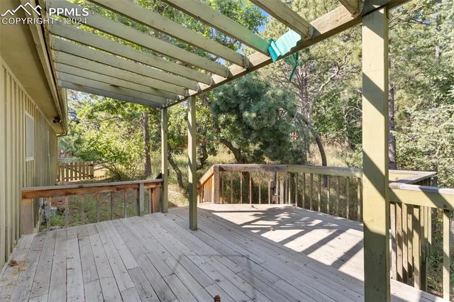 an empty room with large windows