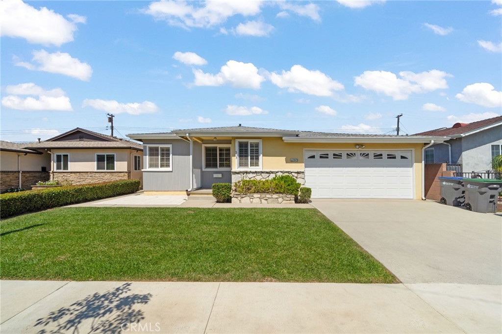 513 West Shadwell Street Carson, CA 90745 - Photo 1 of 23 a front view of a house with a yard and potted plants