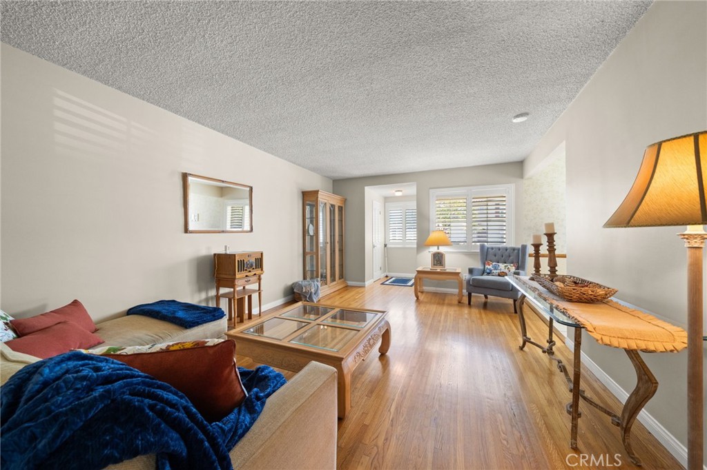 513 West Shadwell Street Carson, CA 90745 - Photo 11 of 23 a living room with furniture and a wooden floor