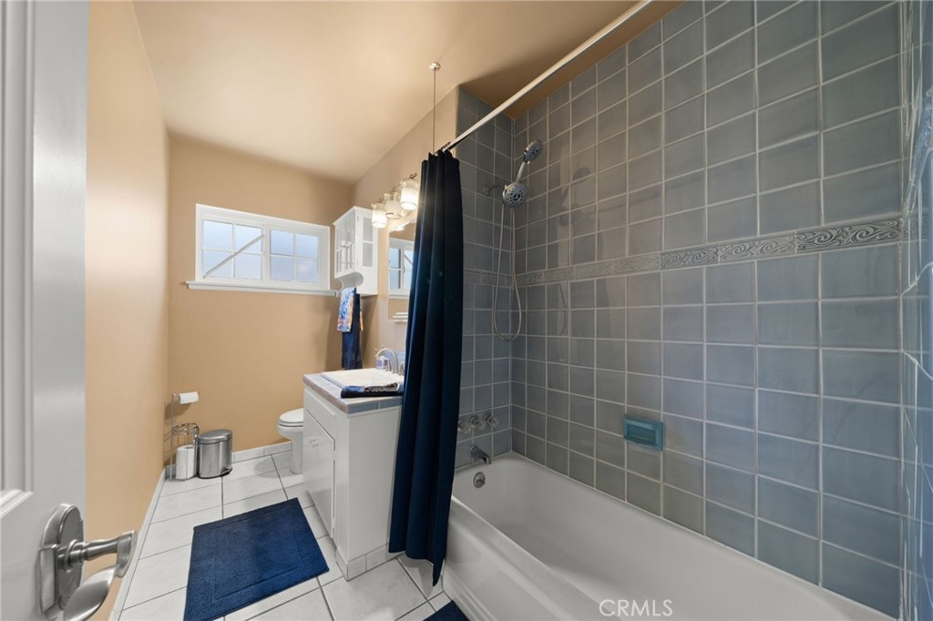 513 West Shadwell Street Carson, CA 90745 - Photo 12 of 23 a bathroom with a bathtub and a toilet