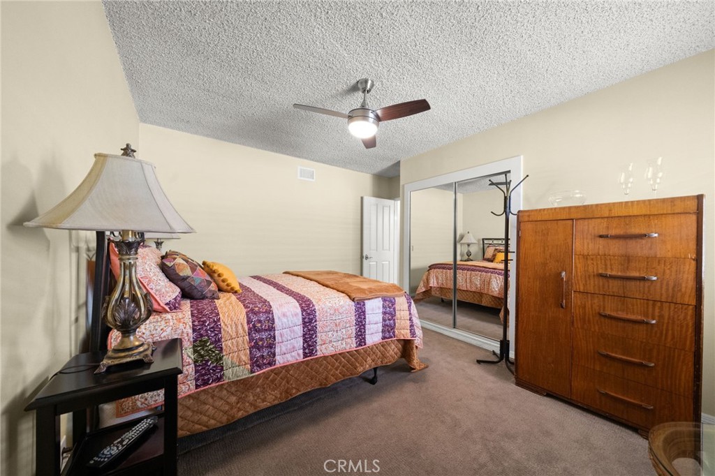 513 West Shadwell Street Carson, CA 90745 - Photo 14 of 23 a bedroom with a bed and a dresser
