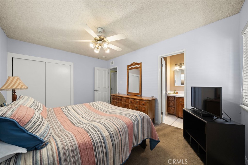 513 West Shadwell Street Carson, CA 90745 - Photo 17 of 23 a bedroom with a bed and a flat screen tv