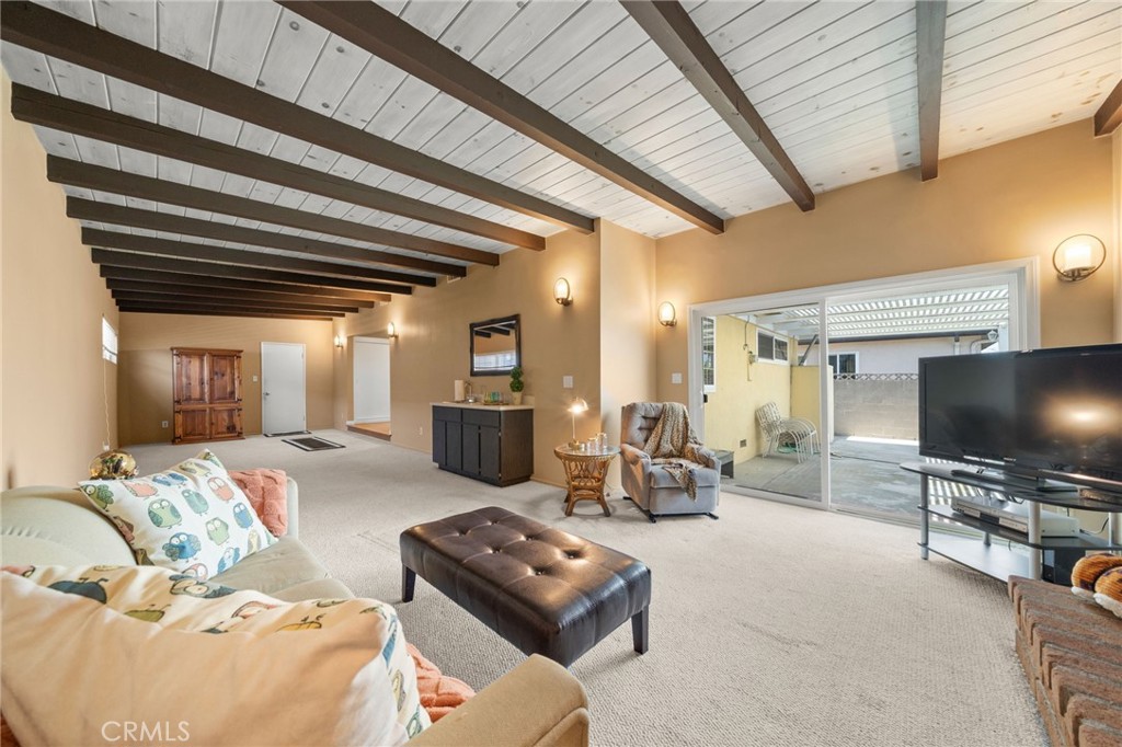 513 West Shadwell Street Carson, CA 90745 - Photo 20 of 23 a living room with furniture and a flat screen tv