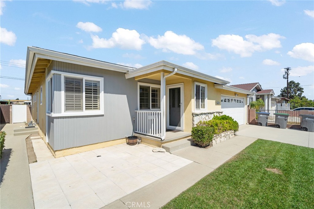 513 West Shadwell Street Carson, CA 90745 - Photo 2 of 23 a front view of a house with a yard