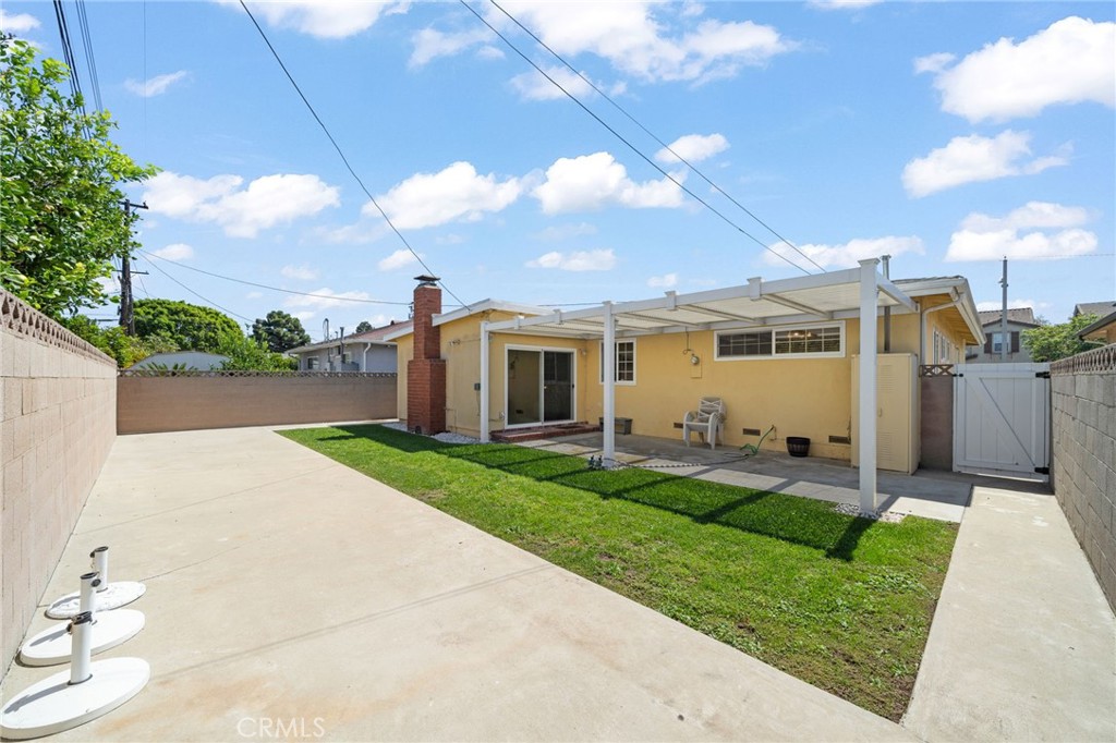 513 West Shadwell Street Carson, CA 90745 - Photo 3 of 23 a front view of a house with a yard and garage