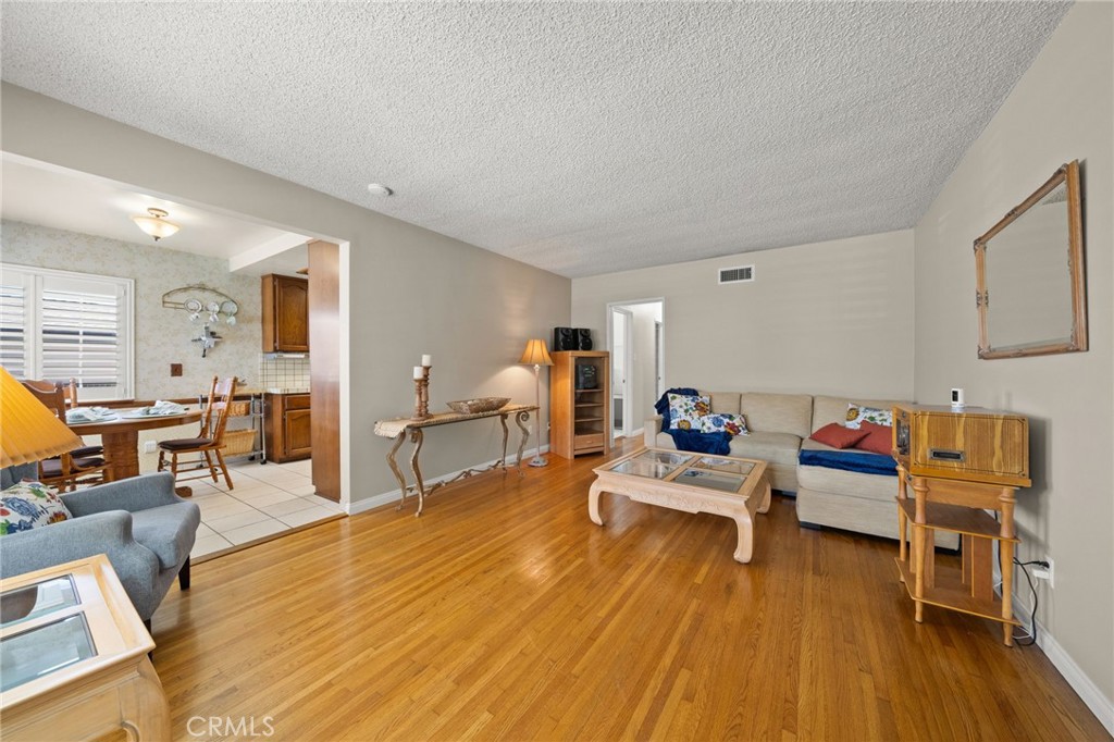 513 West Shadwell Street Carson, CA 90745 - Photo 9 of 23 a living room with furniture and wooden floor