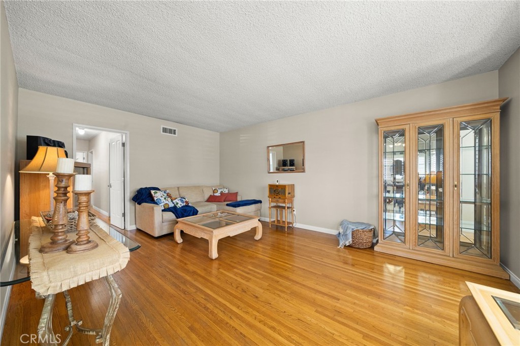 513 West Shadwell Street Carson, CA 90745 - Photo 10 of 23 a living room with furniture and a table