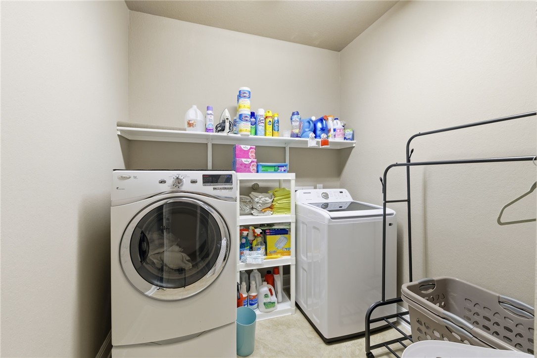 8826 Virginia Rye San Antonio, TX 78254 - Photo 17 of 40 a utility room with dryer and washer