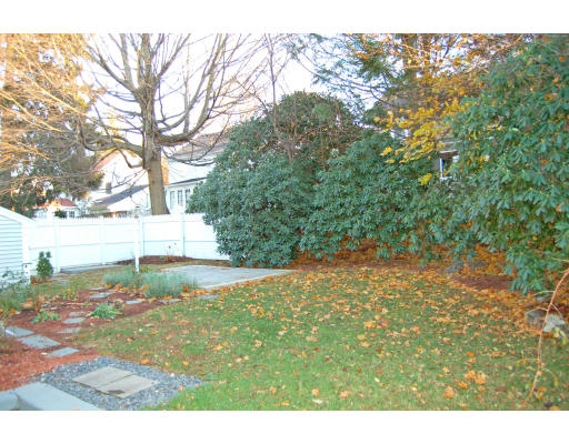20 Bonad Road Milton, MA 02186 - Photo 16 of 17 a backyard of a house with a yard and outdoor seating