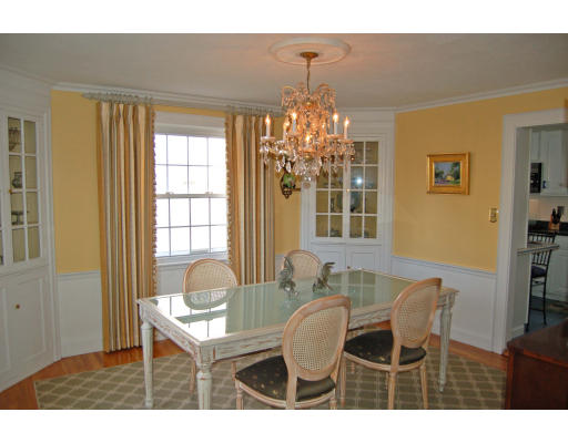 20 Bonad Road Milton, MA 02186 - Photo 6 of 17 a dining room with furniture a chandelier and wooden floor