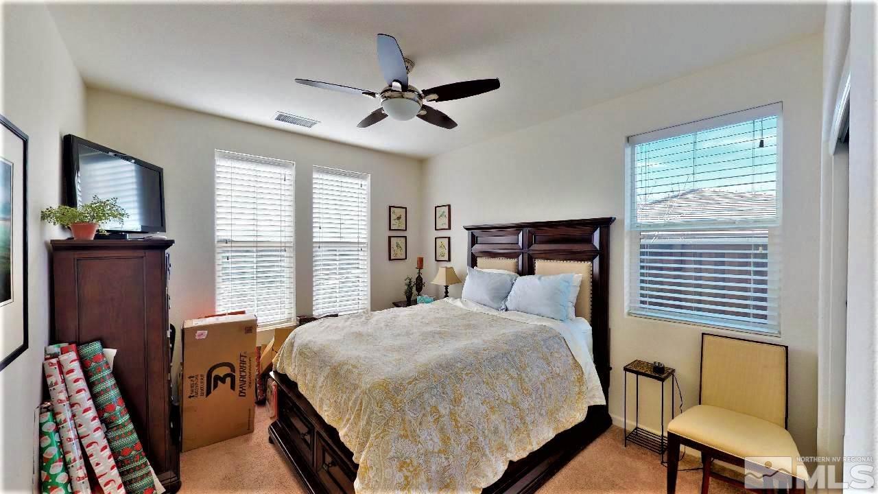 2248 Isabella Drive Sparks, NV 89434 - Photo 10 of 22 a bedroom with a bed and wooden floor