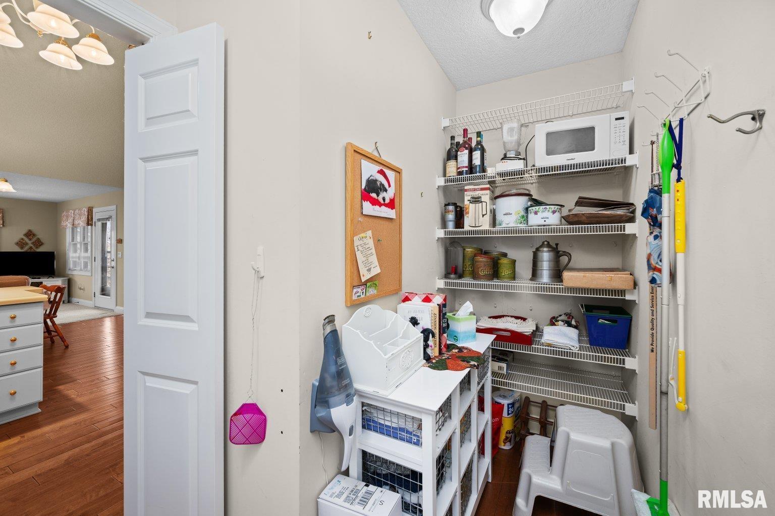 451 Celeste Circle Blue Grass, IA 52726 - Photo 21 of 35 a view of walk in closet with clothes and shoes