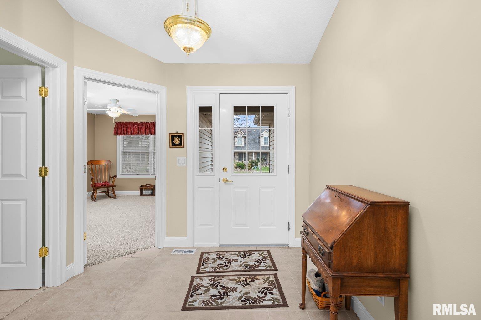 451 Celeste Circle Blue Grass, IA 52726 - Photo 23 of 35 a view of an entryway with wooden floor