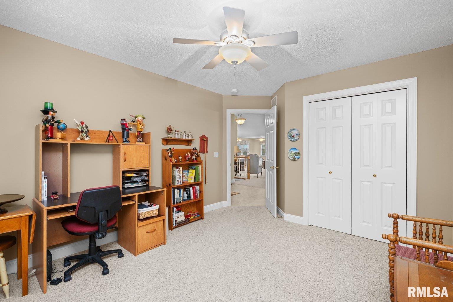 451 Celeste Circle Blue Grass, IA 52726 - Photo 26 of 35 a view of a workspace with furniture