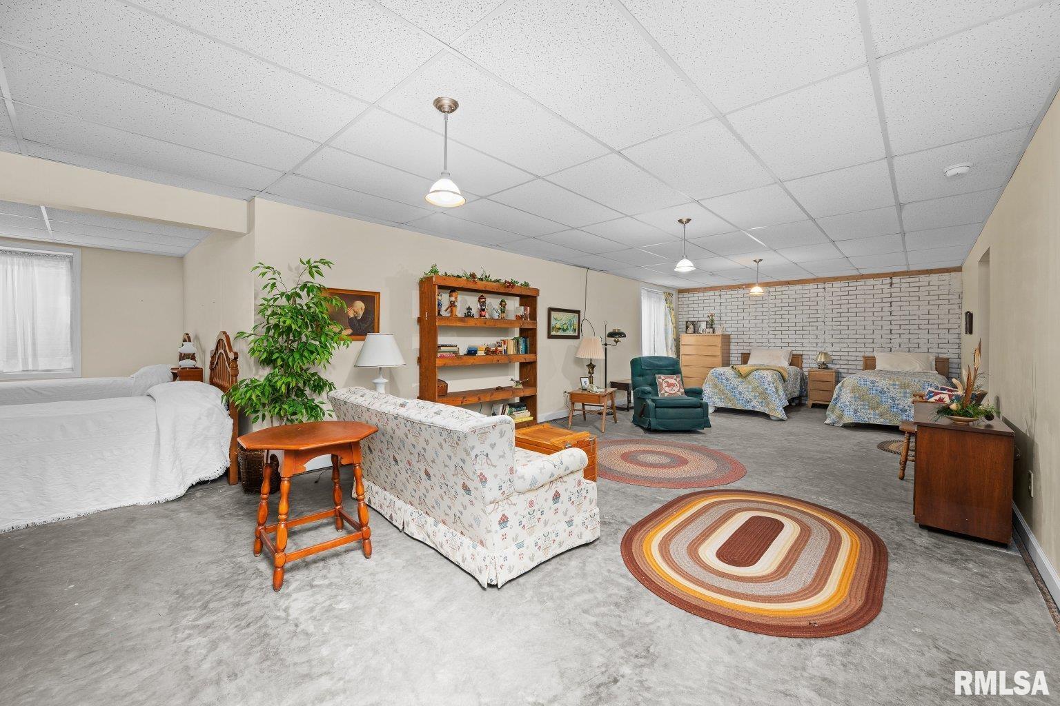 451 Celeste Circle Blue Grass, IA 52726 - Photo 29 of 35 a living room with furniture and a wooden floor