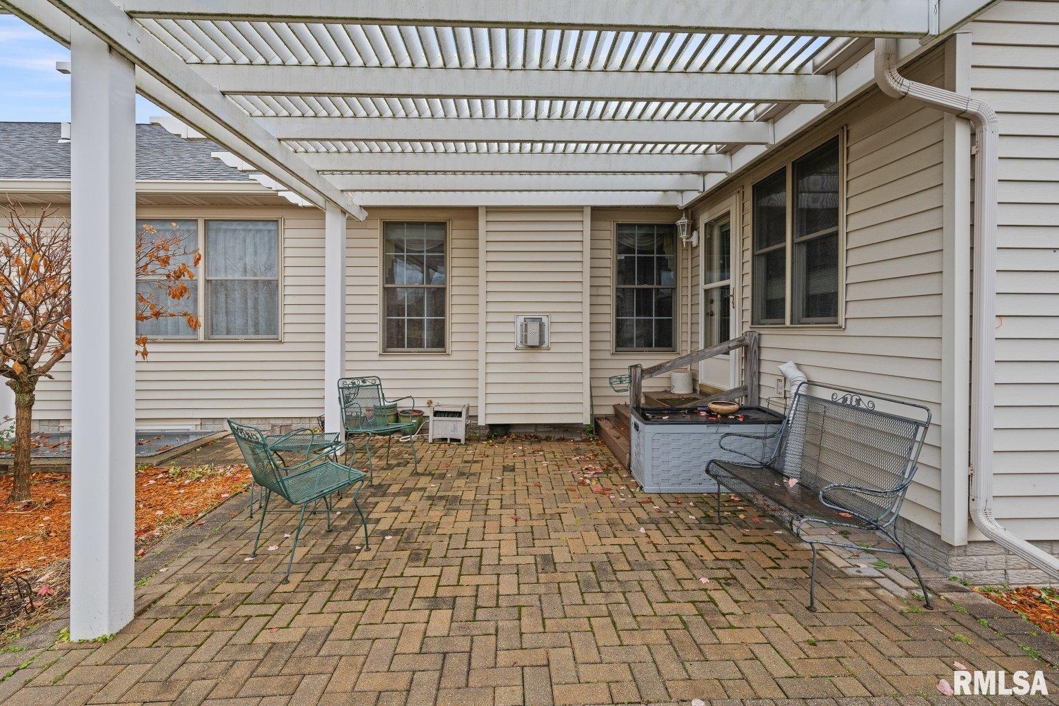 451 Celeste Circle Blue Grass, IA 52726 - Photo 35 of 35 a front view of a house with outdoor seating