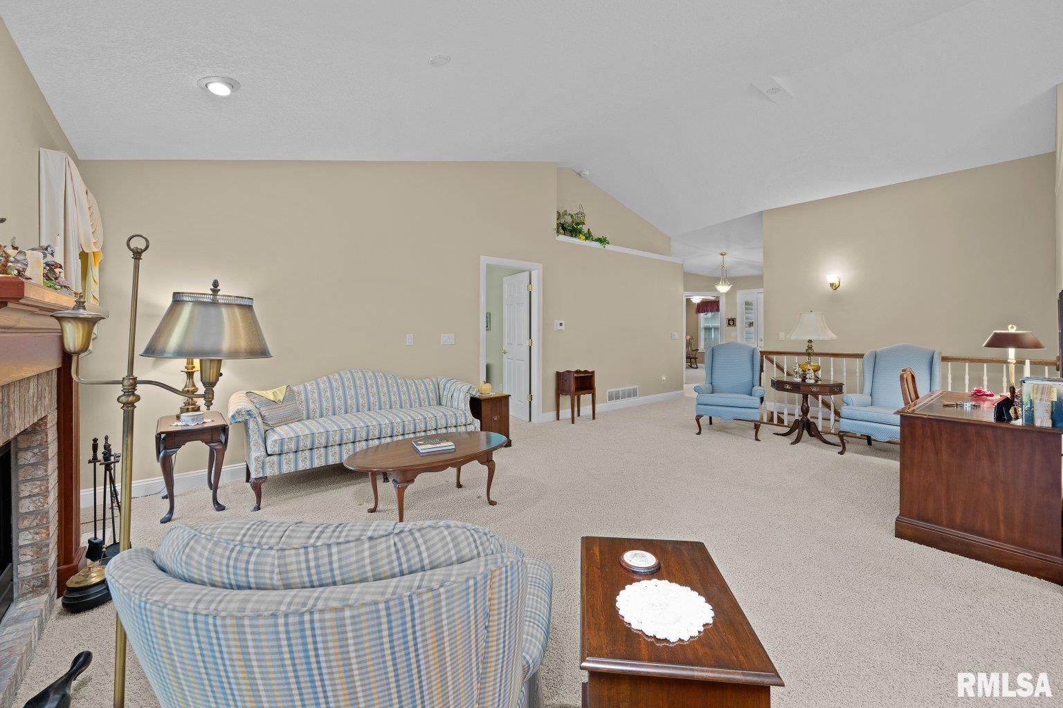 451 Celeste Circle Blue Grass, IA 52726 - Photo 10 of 35 a living room with furniture and a window