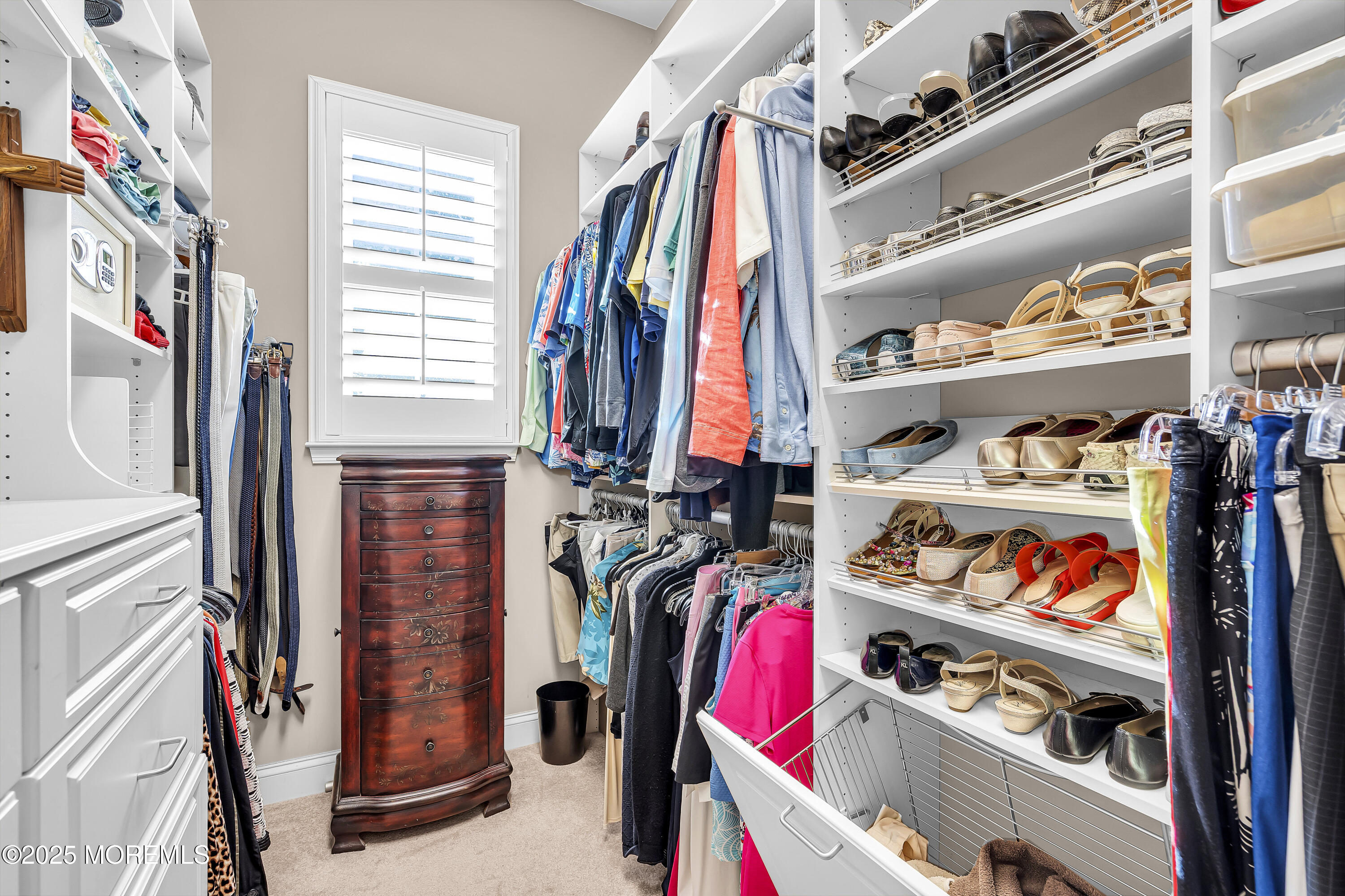 14 Harvey Cedar Way Waretown, NJ 08758 - Photo 31 of 59 a view of walk in closet with clothes and shoes