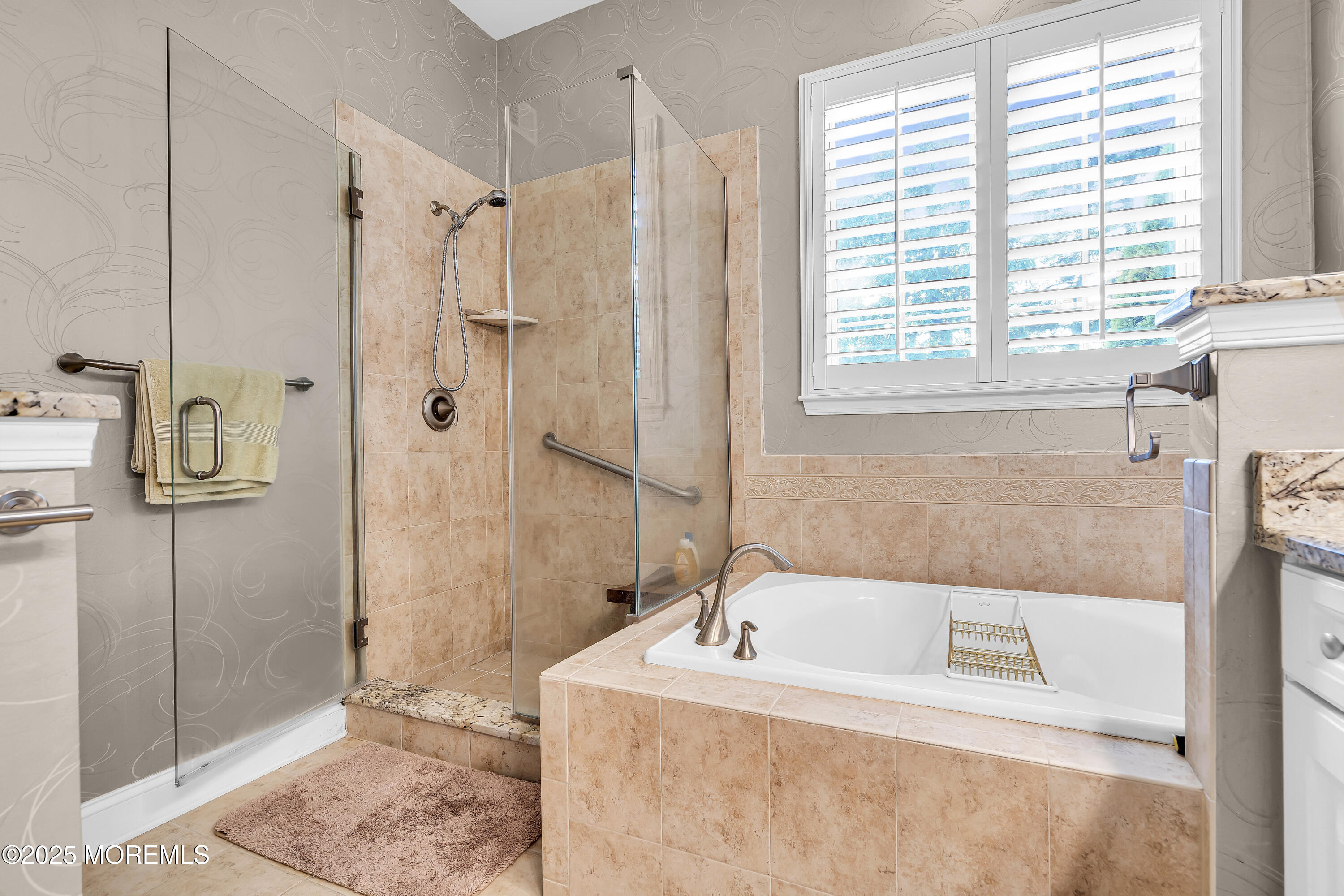 14 Harvey Cedar Way Waretown, NJ 08758 - Photo 33 of 59 a bathroom with a tub sink and shower