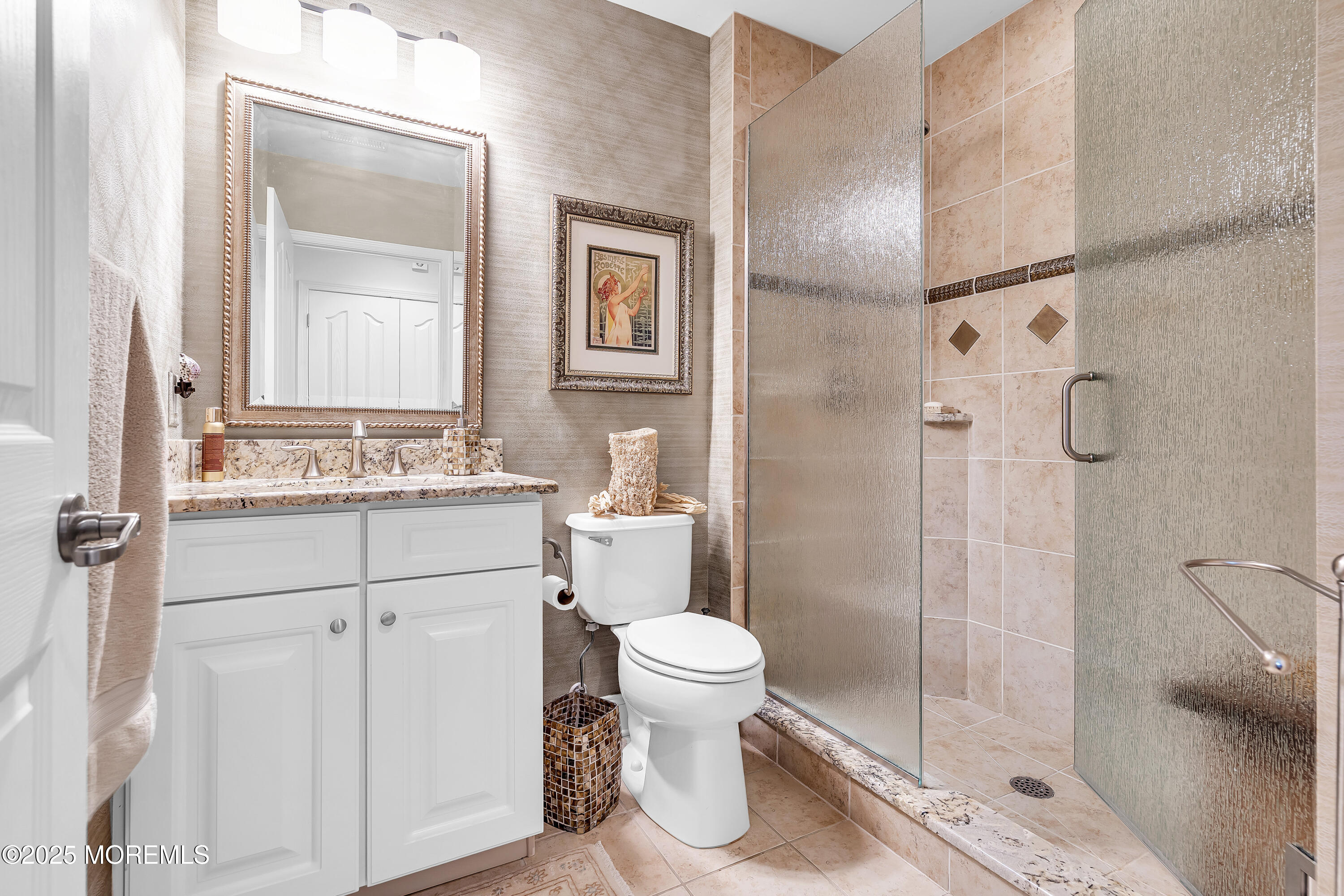 14 Harvey Cedar Way Waretown, NJ 08758 - Photo 36 of 59 a bathroom with a sink a toilet and shower