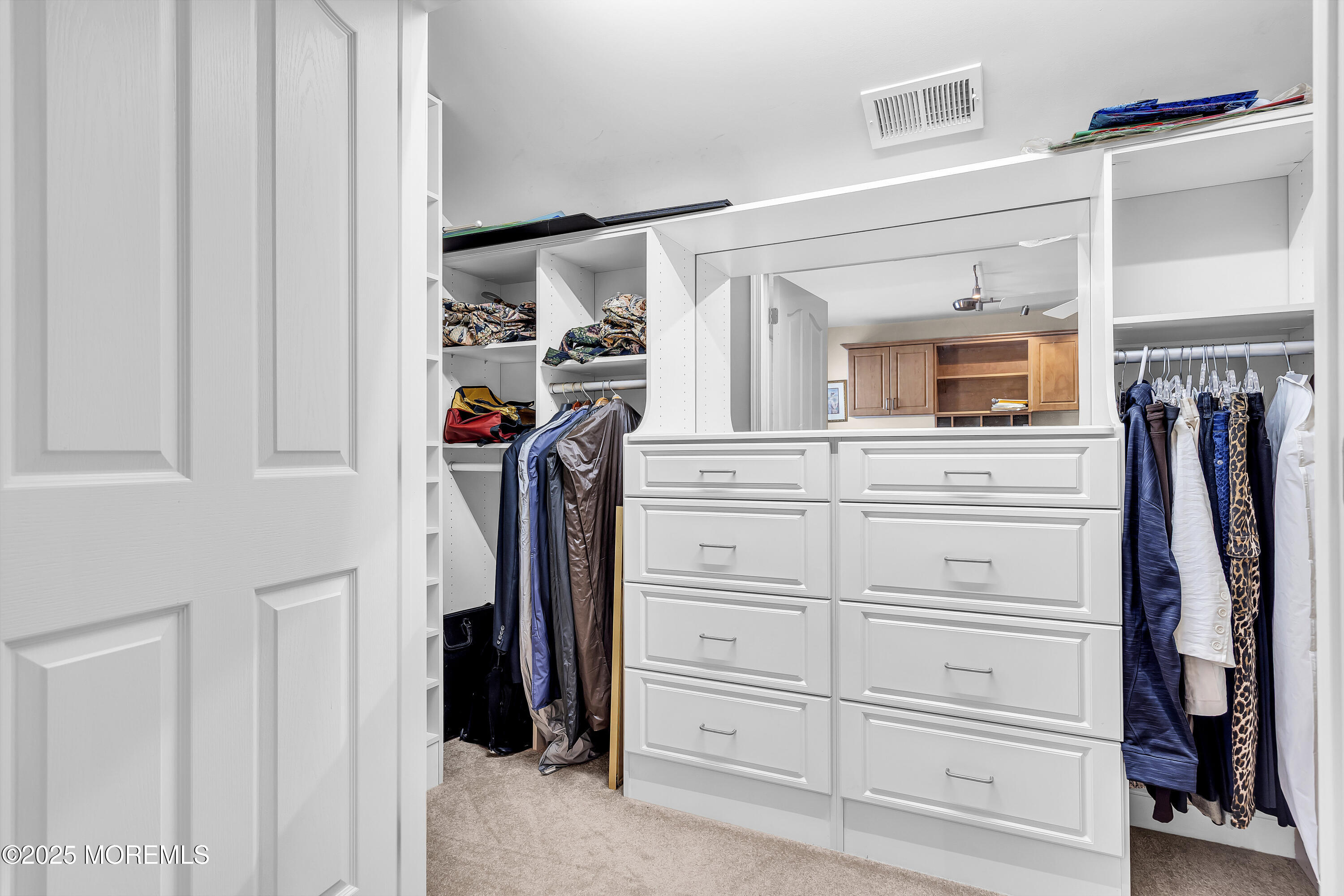 14 Harvey Cedar Way Waretown, NJ 08758 - Photo 44 of 59 a view of walk in closet with clothes and shoes