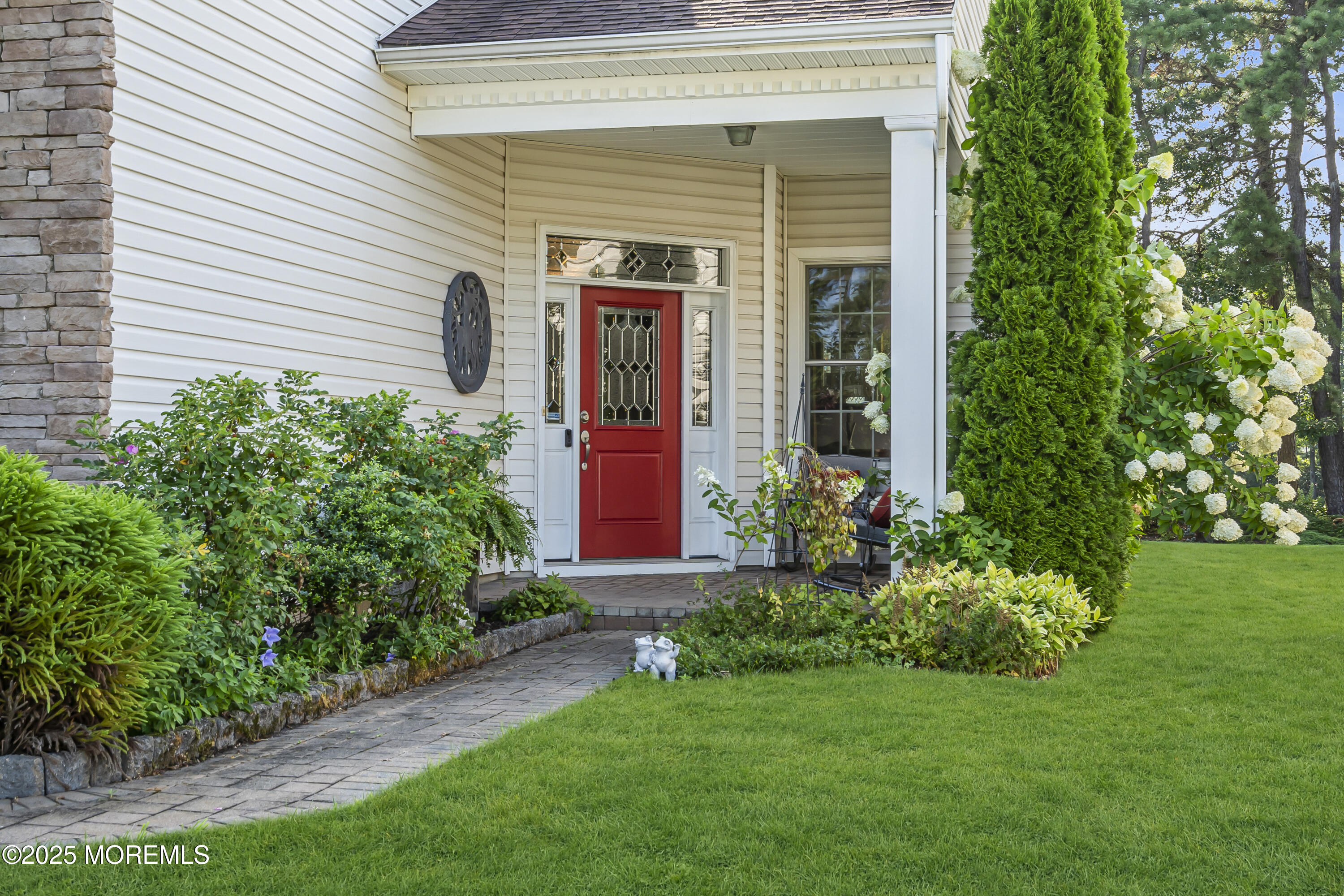 14 Harvey Cedar Way Waretown, NJ 08758 - Photo 5 of 59 a front view of a house with garden