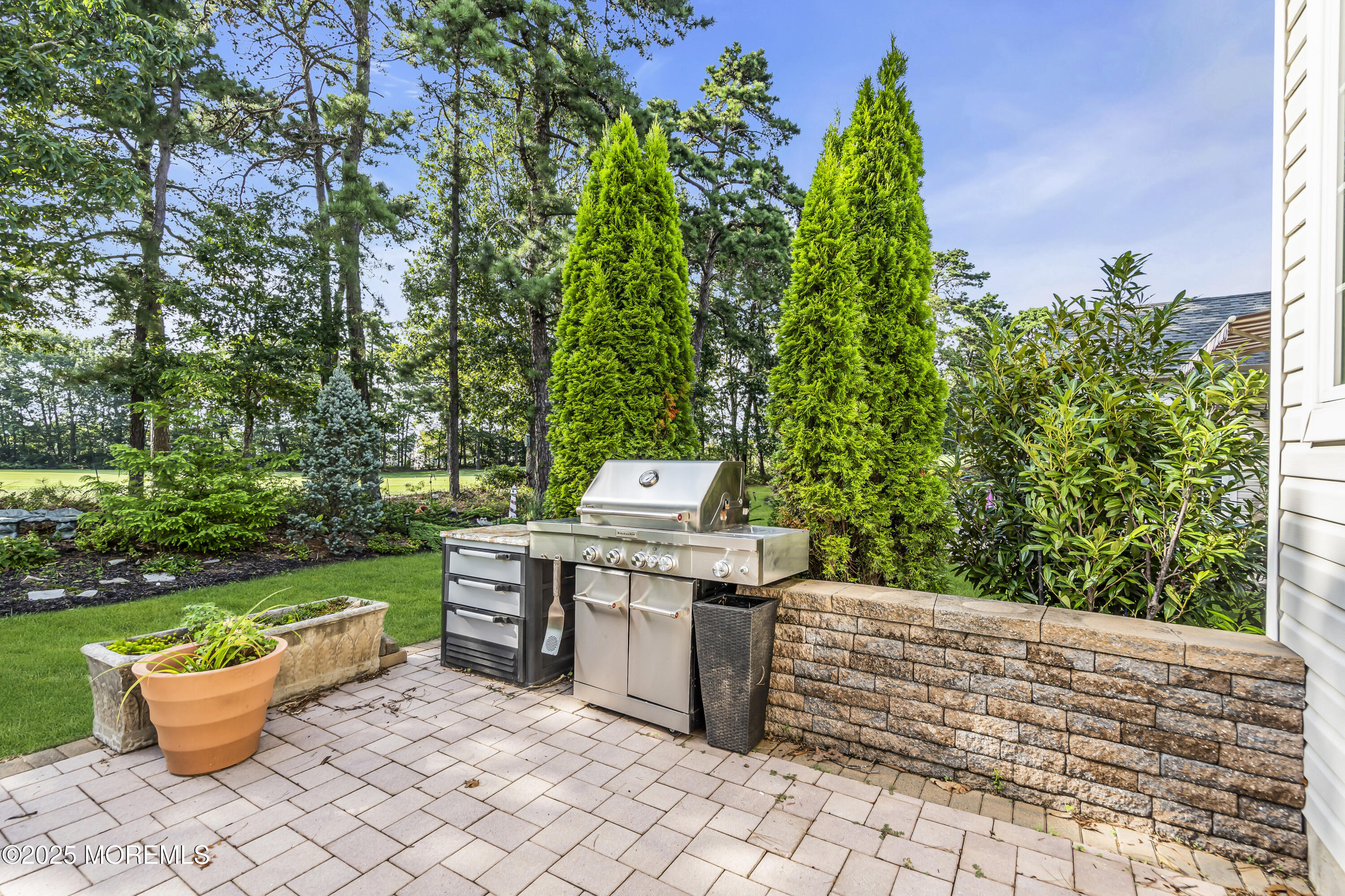 14 Harvey Cedar Way Waretown, NJ 08758 - Photo 51 of 59 a view of a backyard with chair and potted plants