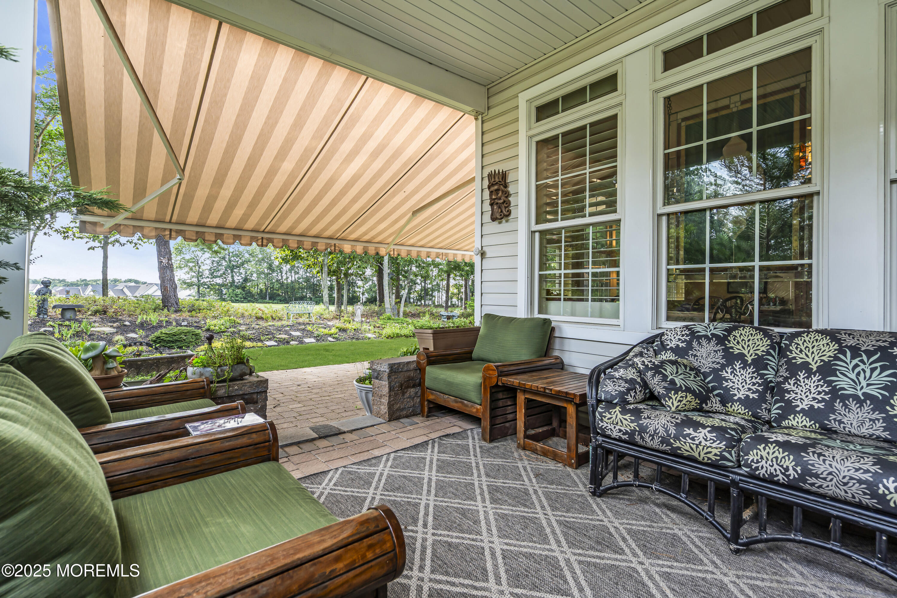 14 Harvey Cedar Way Waretown, NJ 08758 - Photo 53 of 59 a view of a patio with couches chairs and a backyard