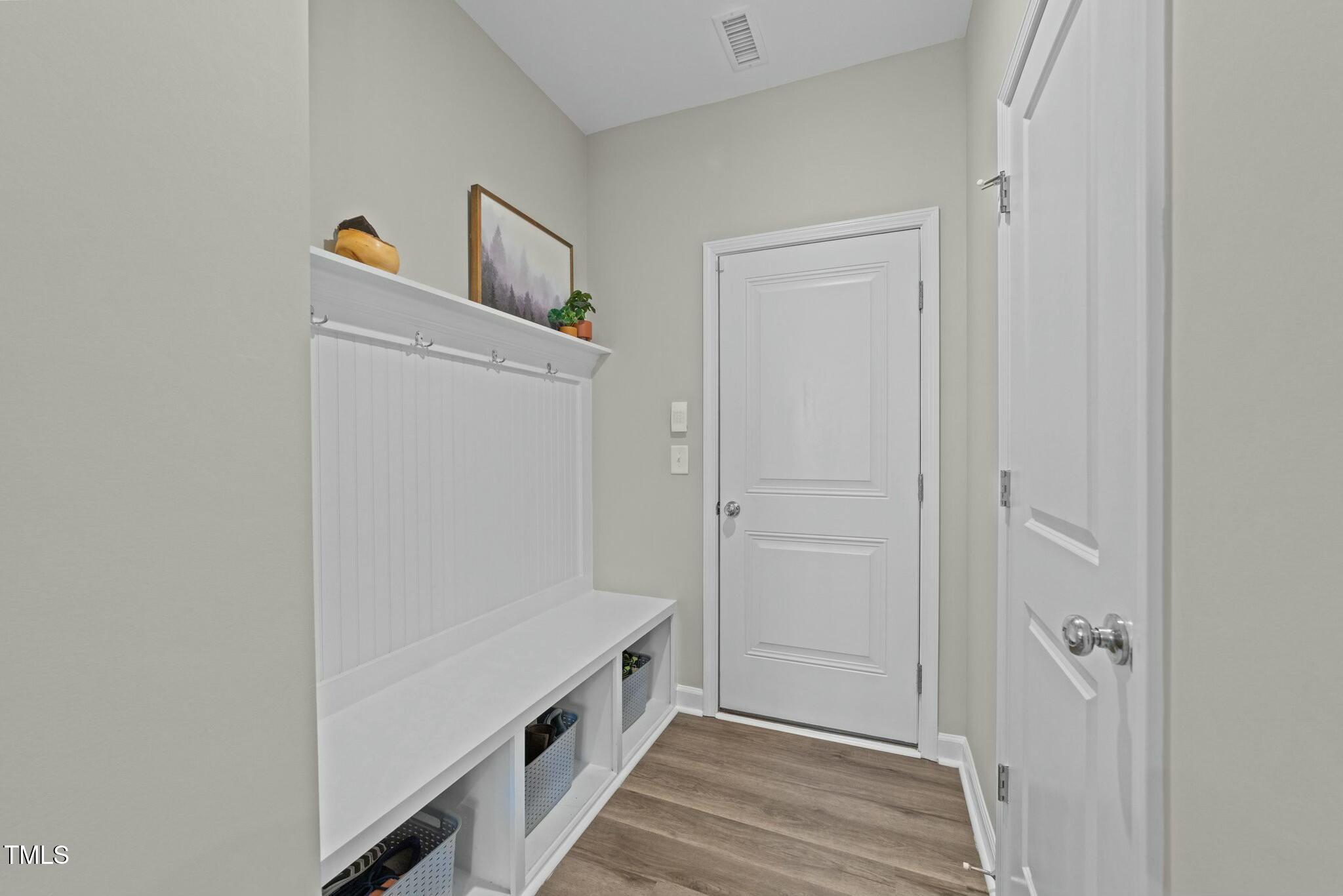 118 Lockhaven Drive Garner, NC 27529 - Photo 15 of 56 a view of a hallway with wooden floor and closet