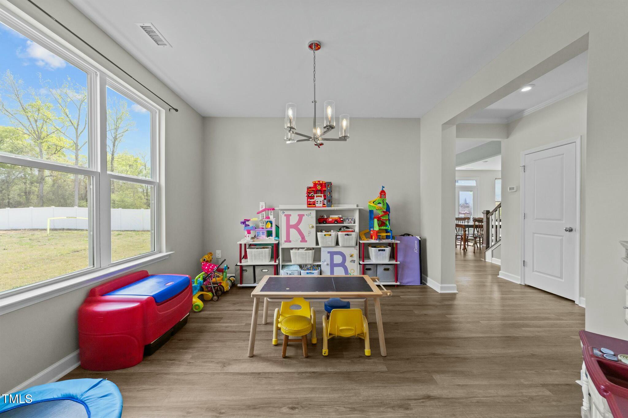 118 Lockhaven Drive Garner, NC 27529 - Photo 18 of 56 a bedroom with furniture and window