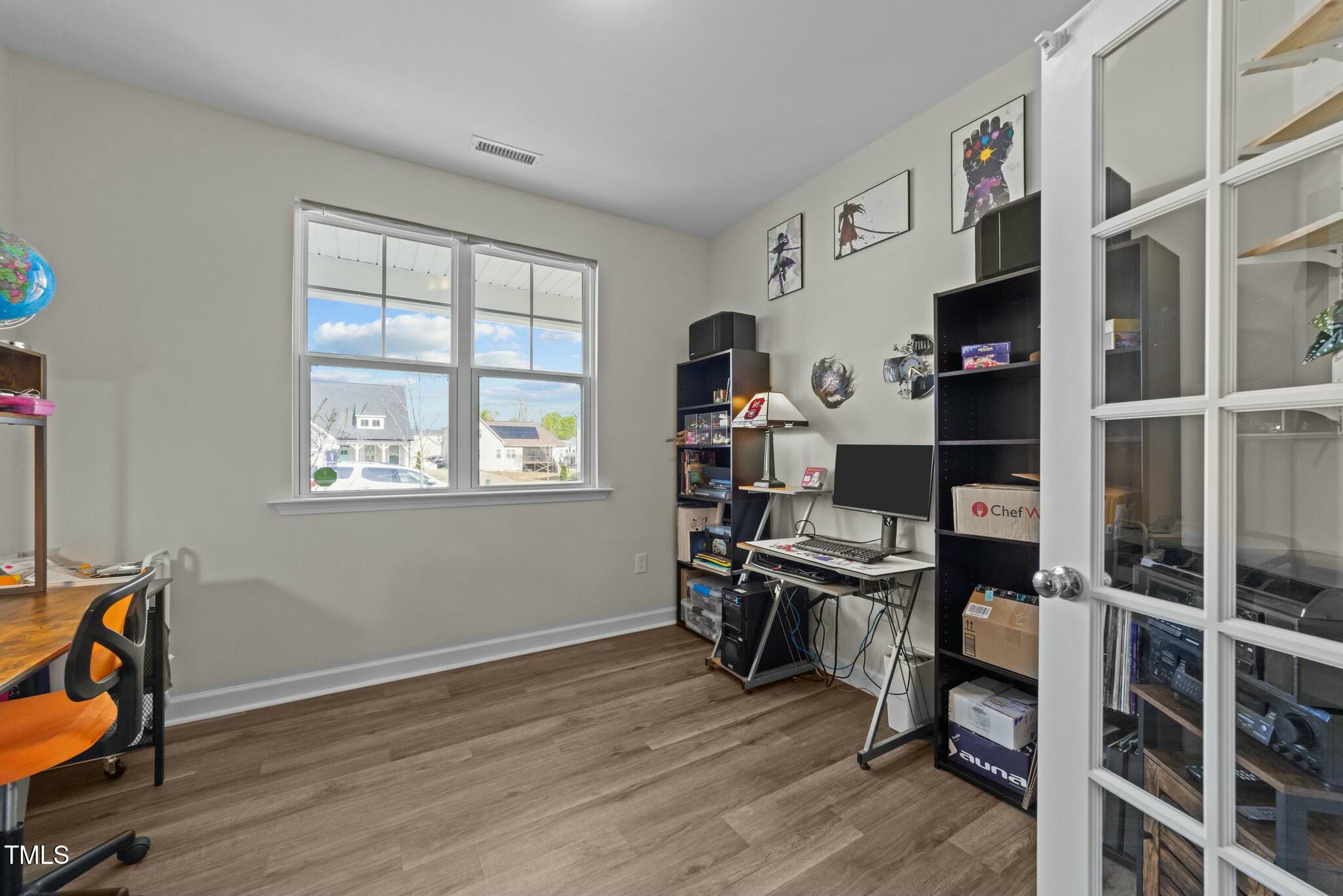 118 Lockhaven Drive Garner, NC 27529 - Photo 19 of 56 a view of a workspace with furniture and a window
