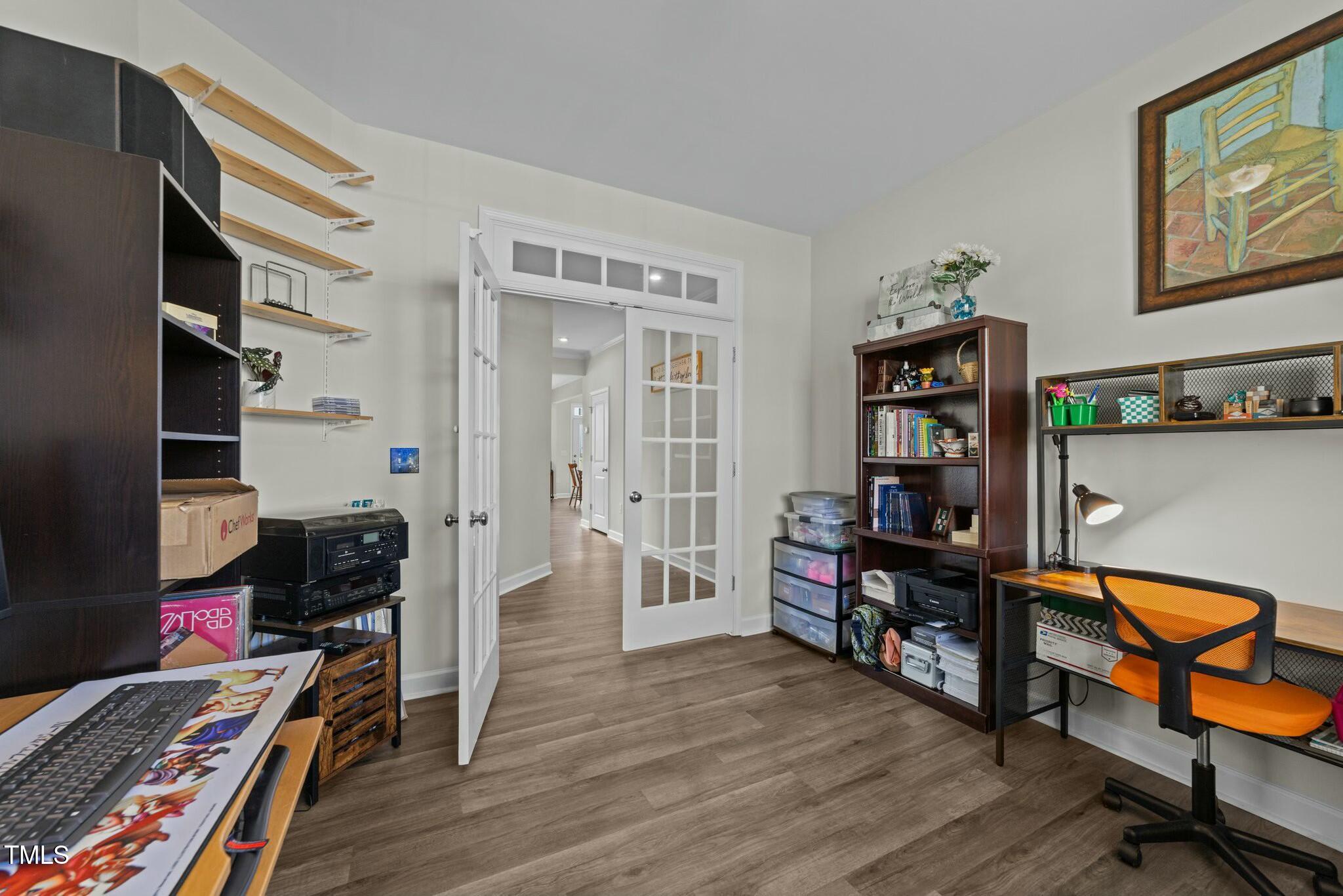 118 Lockhaven Drive Garner, NC 27529 - Photo 20 of 56 a view of a workspace with furniture and wooden floor