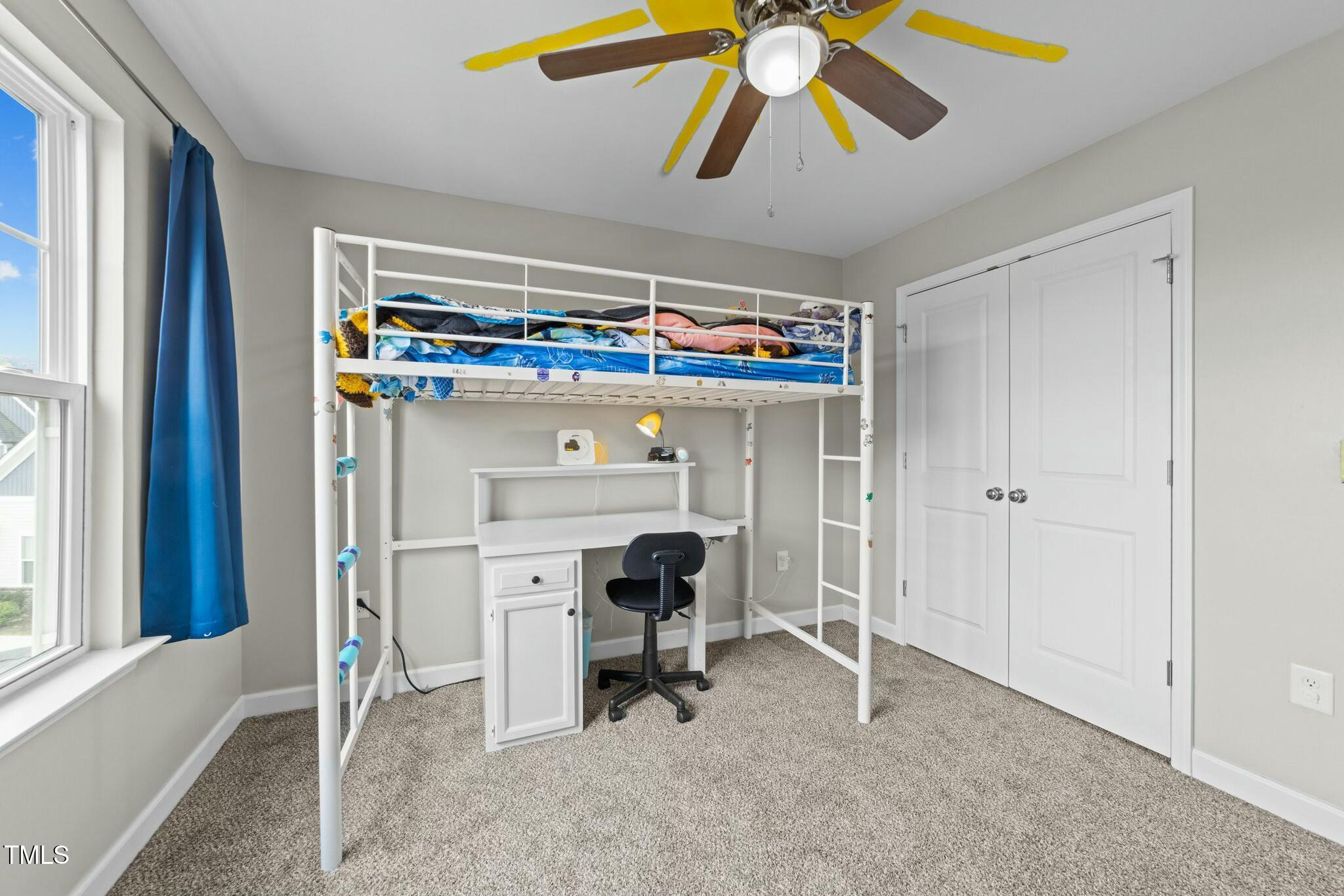 118 Lockhaven Drive Garner, NC 27529 - Photo 28 of 56 a view of a room that has a bed and a chandelier