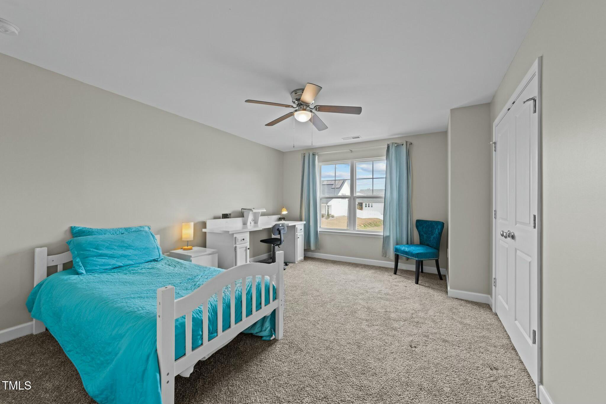 118 Lockhaven Drive Garner, NC 27529 - Photo 29 of 56 a bedroom with furniture and a chandelier