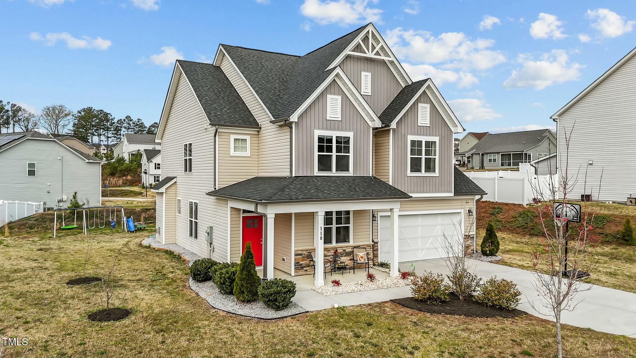 118 Lockhaven Drive Garner, NC 27529 - Photo 2 of 56 a front view of a house with garden