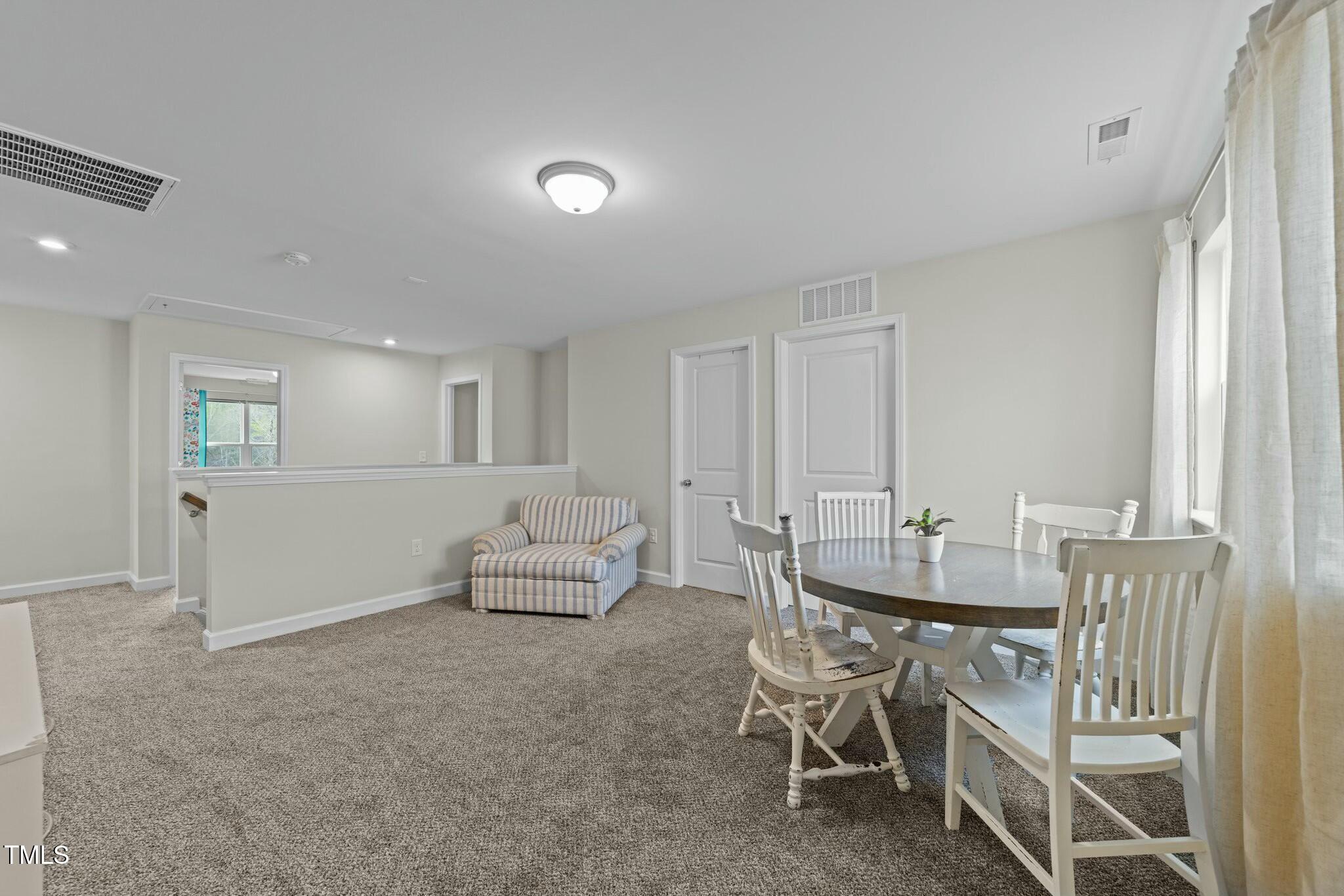 118 Lockhaven Drive Garner, NC 27529 - Photo 34 of 56 a dining room with furniture and wooden floor