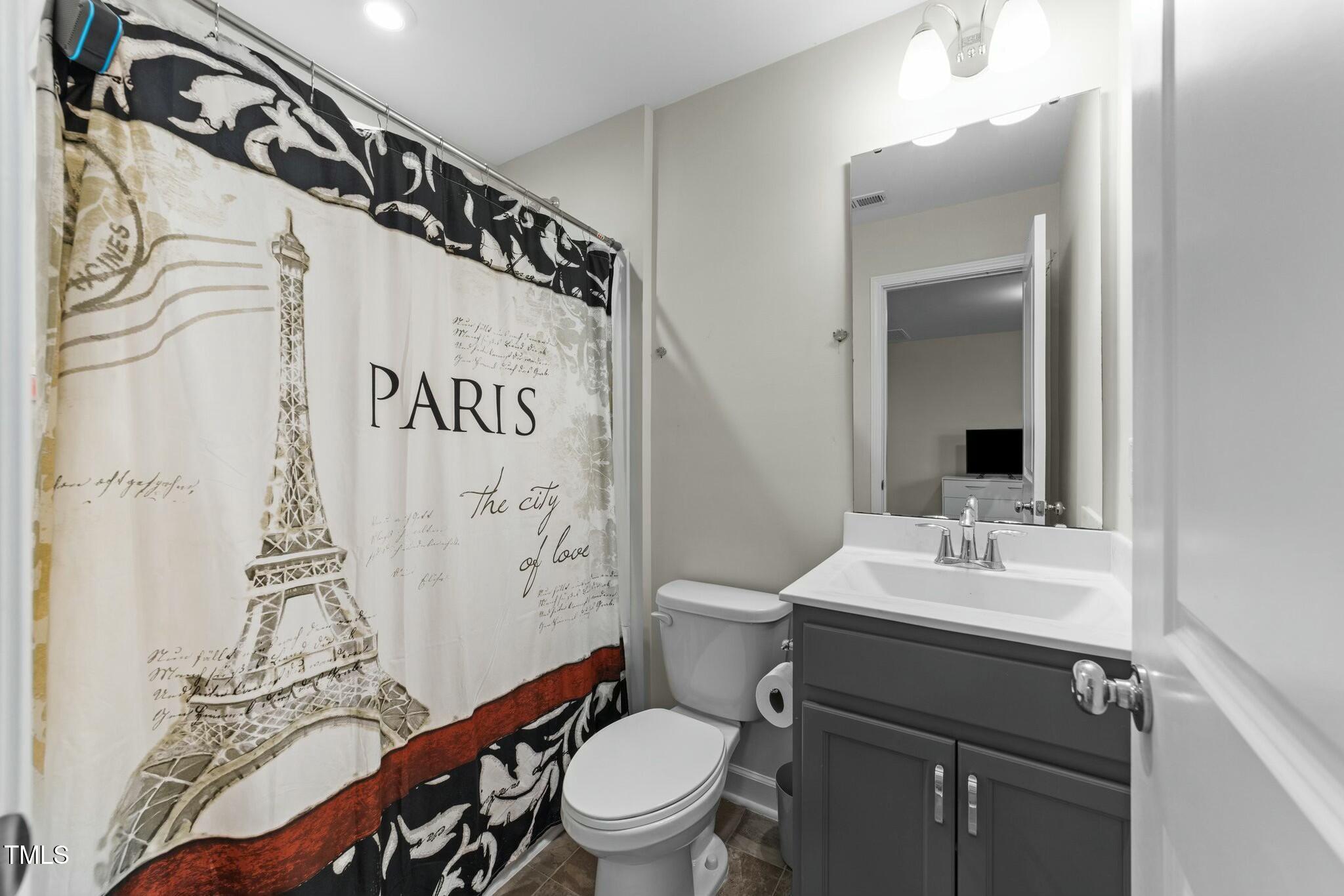 118 Lockhaven Drive Garner, NC 27529 - Photo 35 of 56 a bathroom with a toilet sink and mirror