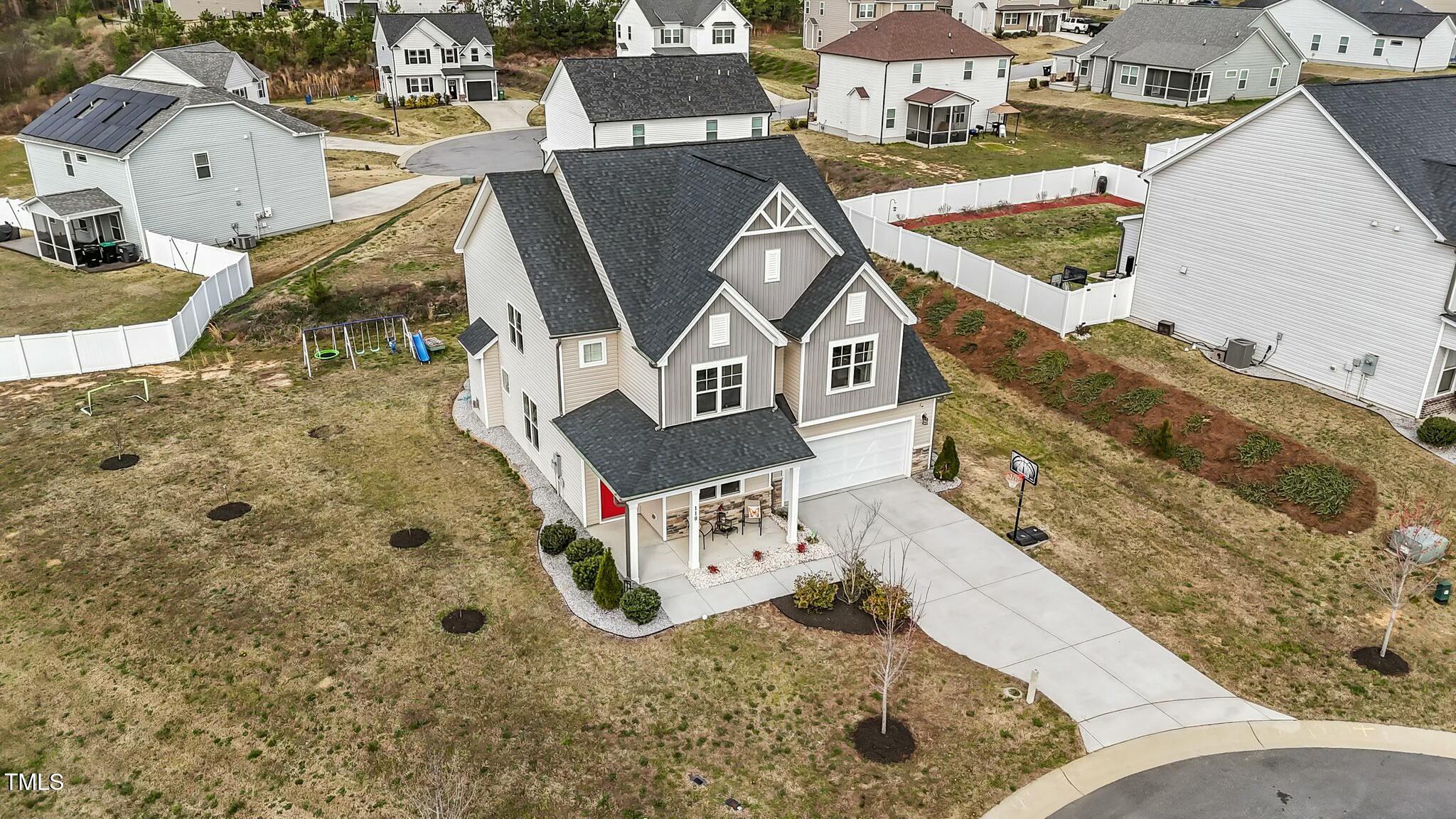 118 Lockhaven Drive Garner, NC 27529 - Photo 3 of 56 an aerial view of a house with swimming pool