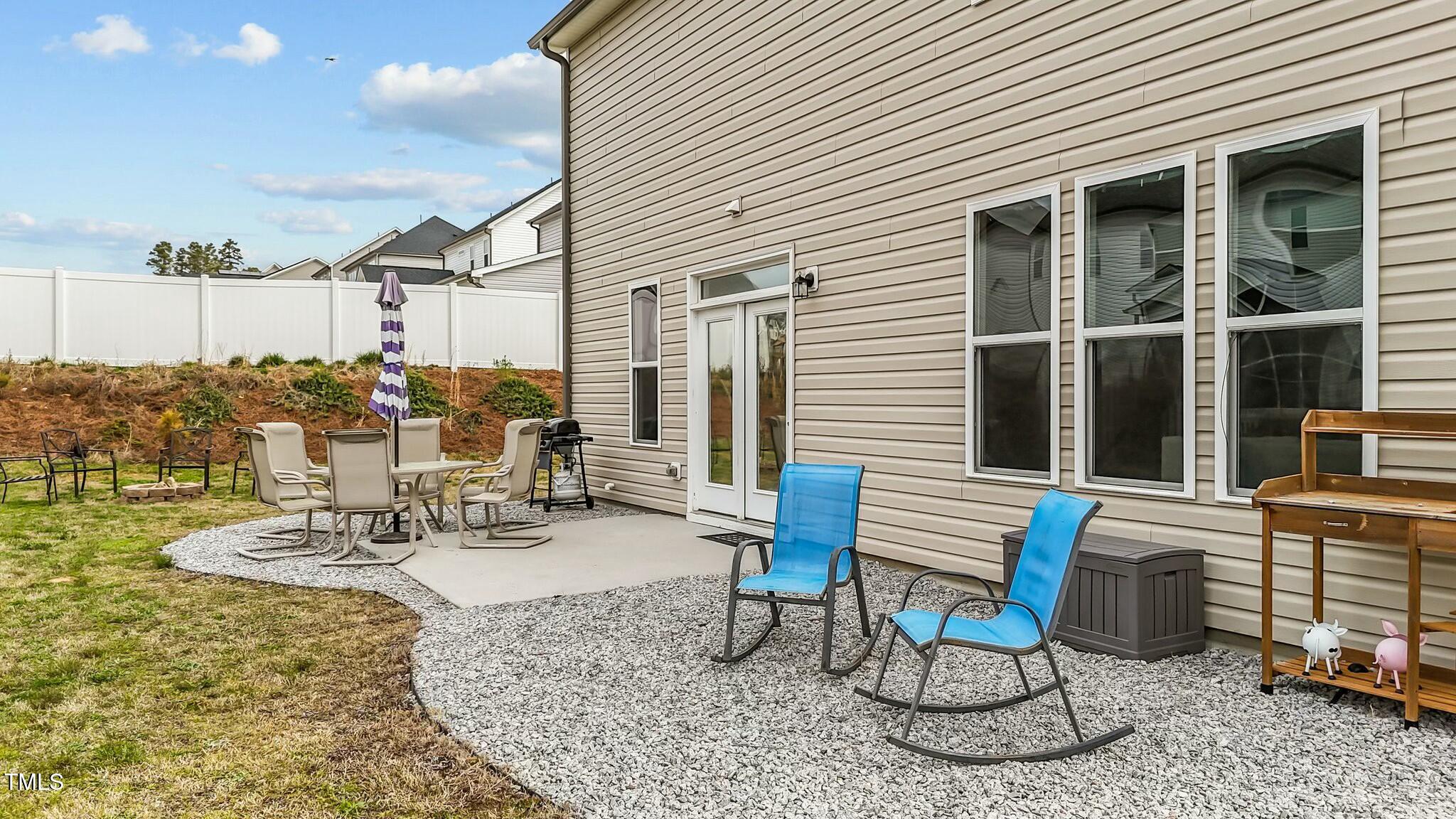 118 Lockhaven Drive Garner, NC 27529 - Photo 41 of 56 a view of a patio with chairs and table in a patio