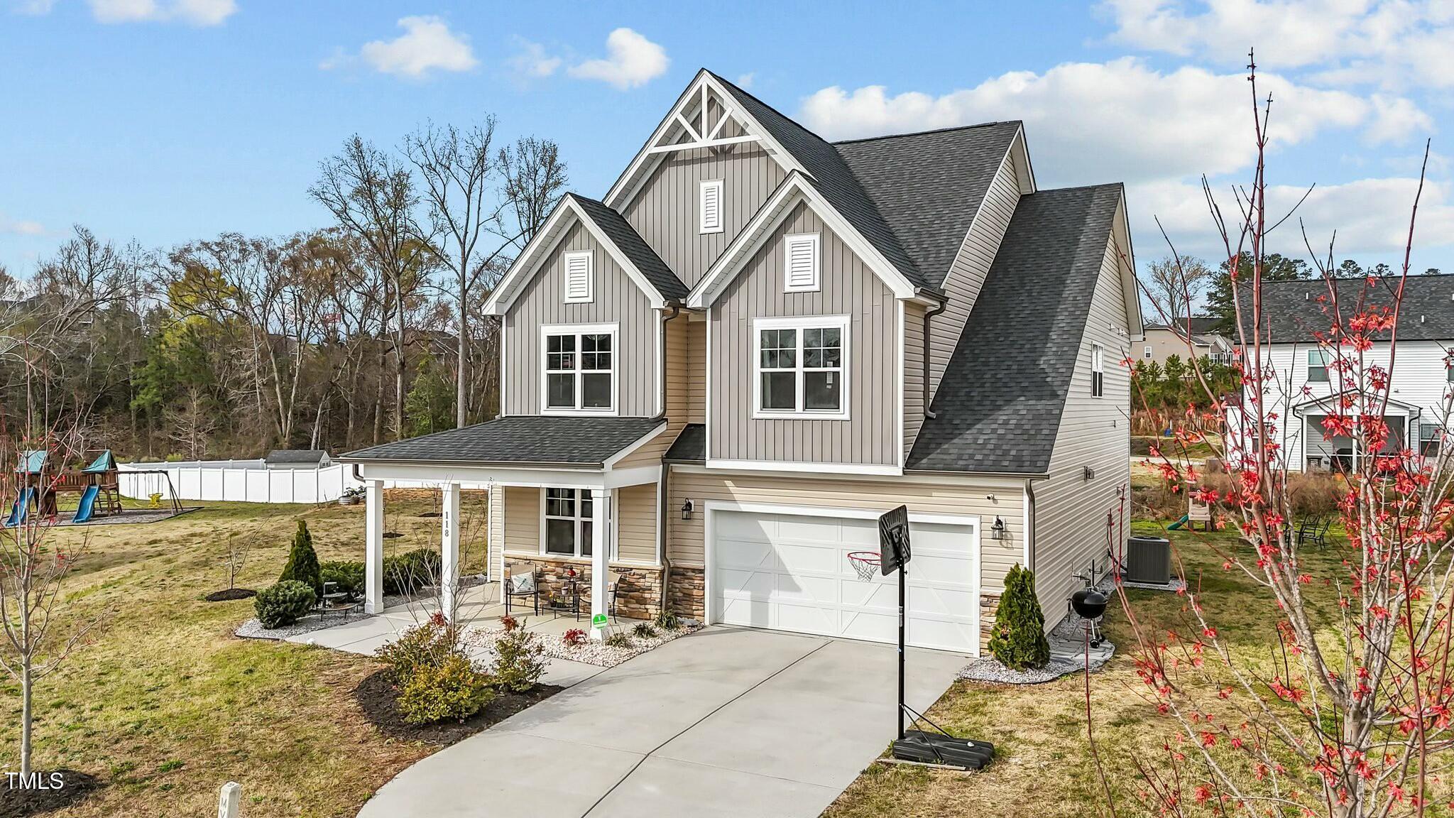 118 Lockhaven Drive Garner, NC 27529 - Photo 52 of 56 a front view of a house with a yard
