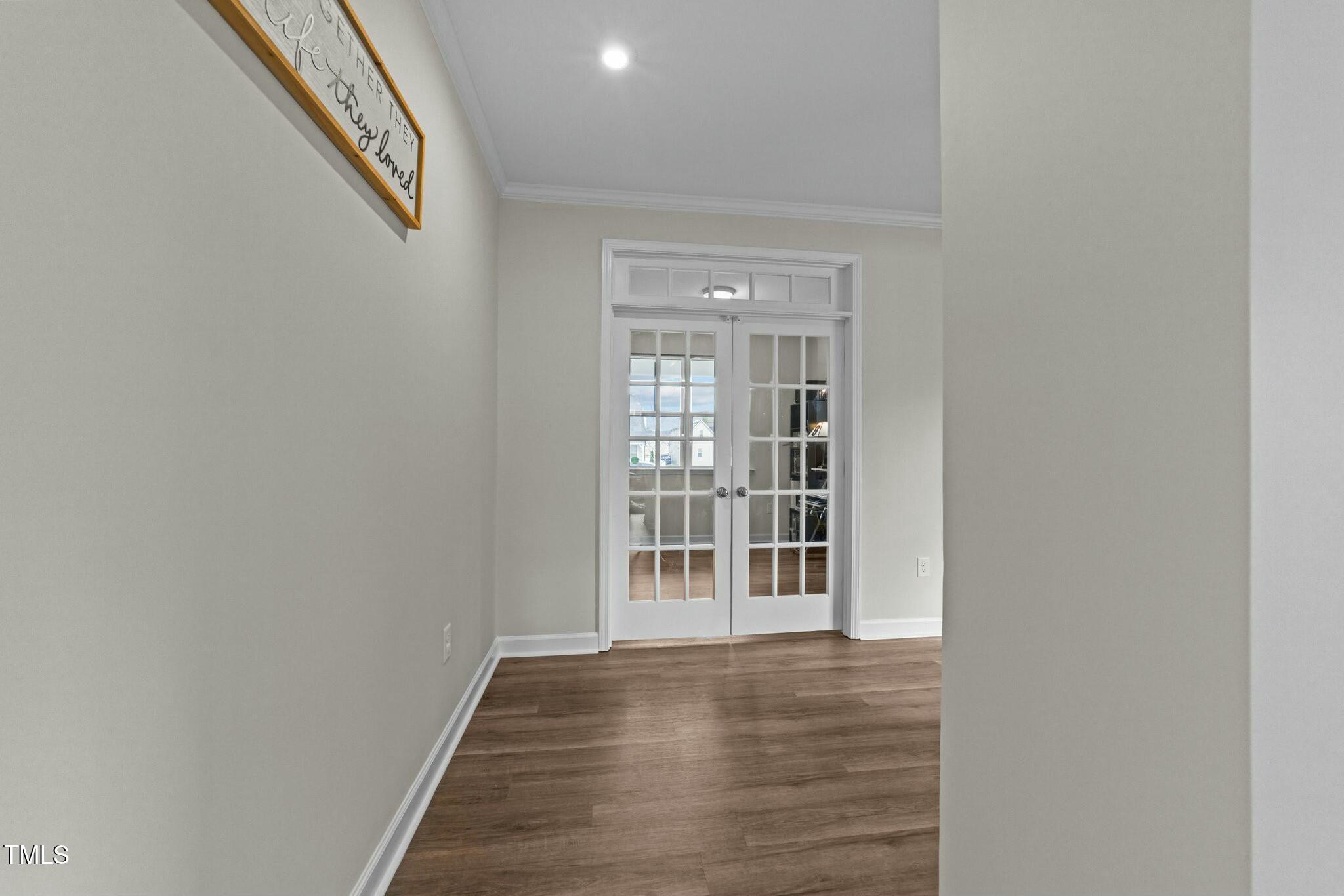 118 Lockhaven Drive Garner, NC 27529 - Photo 6 of 56 an empty room with wooden floor and windows