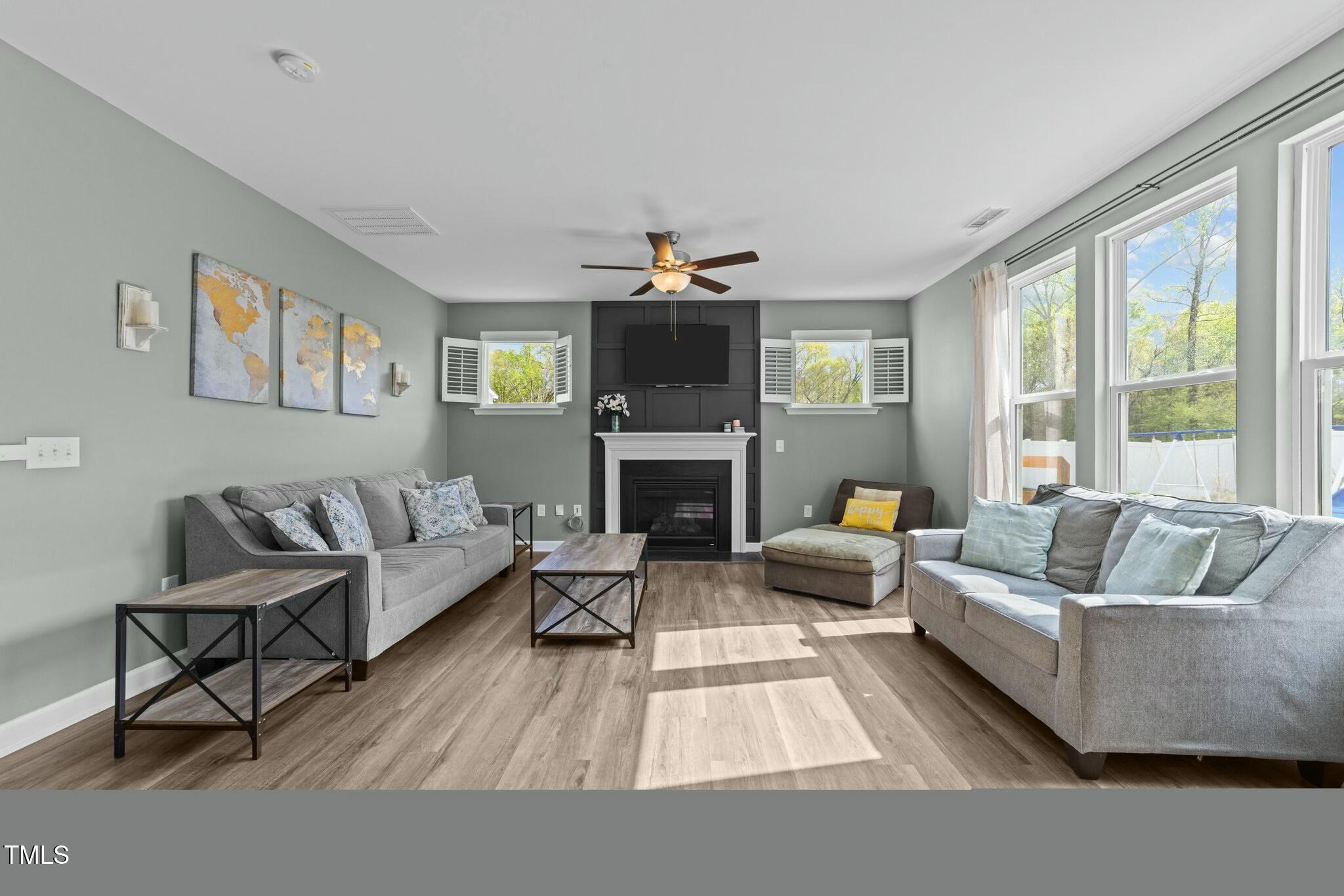 118 Lockhaven Drive Garner, NC 27529 - Photo 7 of 56 a living room with furniture and a fireplace