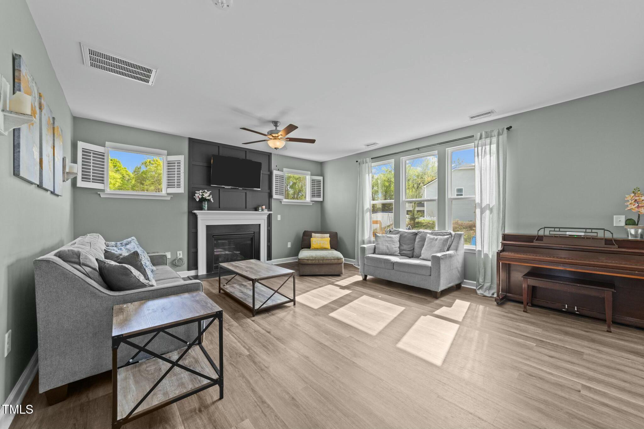 118 Lockhaven Drive Garner, NC 27529 - Photo 8 of 56 a living room with furniture and a fireplace