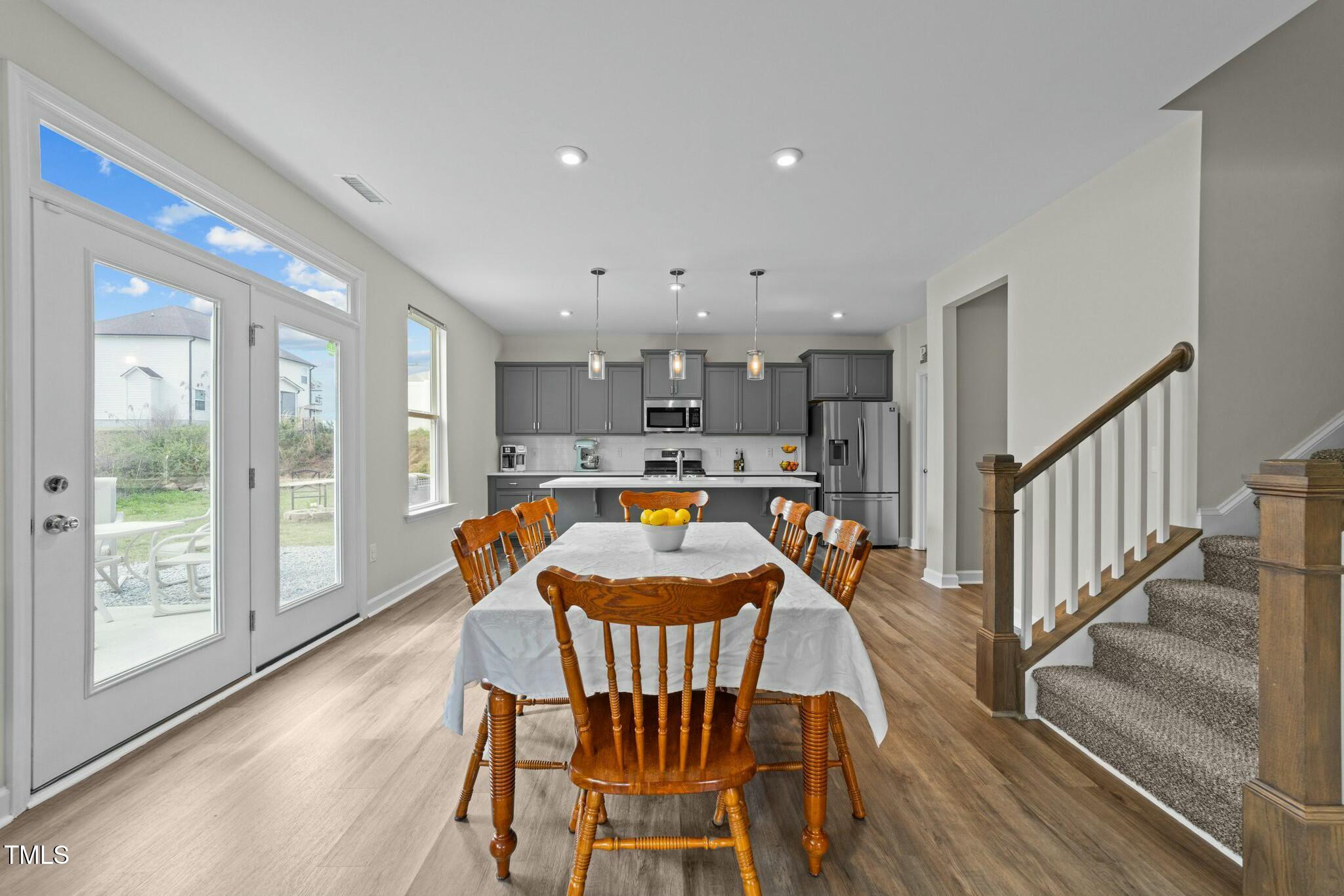 118 Lockhaven Drive Garner, NC 27529 - Photo 9 of 56 a view of a dining room with a table and chairs