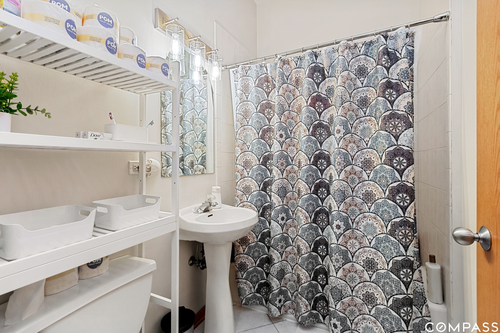 2136 West Monroe Street, Unit 204 Chicago, IL 60612 - Photo 12 of 15 a bathroom with a sink toilet and shower