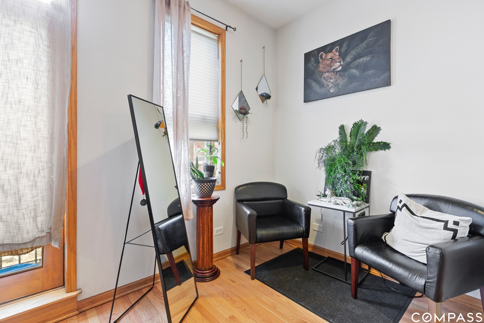 2136 West Monroe Street, Unit 204 Chicago, IL 60612 - Photo 4 of 15 a living room with furniture and a potted plant