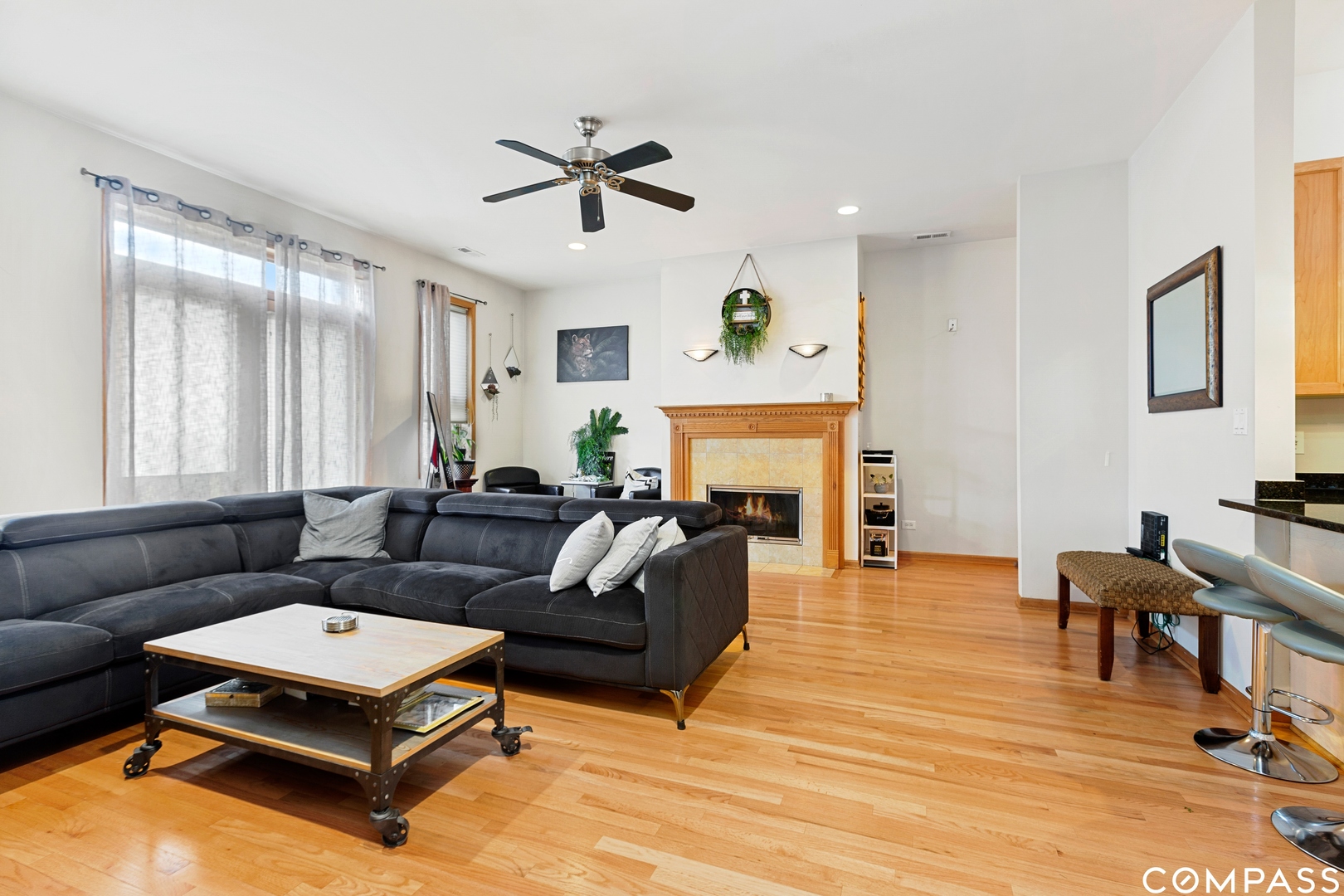 2136 West Monroe Street, Unit 204 Chicago, IL 60612 - Photo 6 of 15 a living room with furniture and a fireplace
