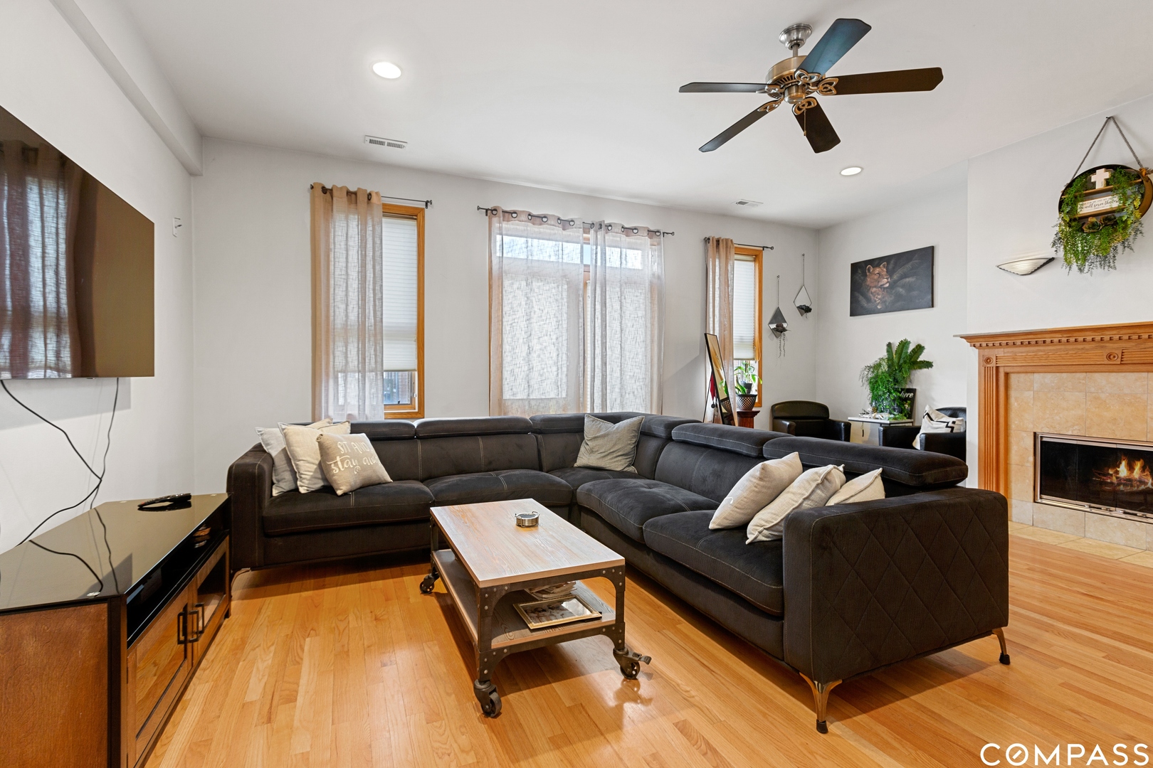 2136 West Monroe Street, Unit 204 Chicago, IL 60612 - Photo 7 of 15 a living room with furniture and a fireplace