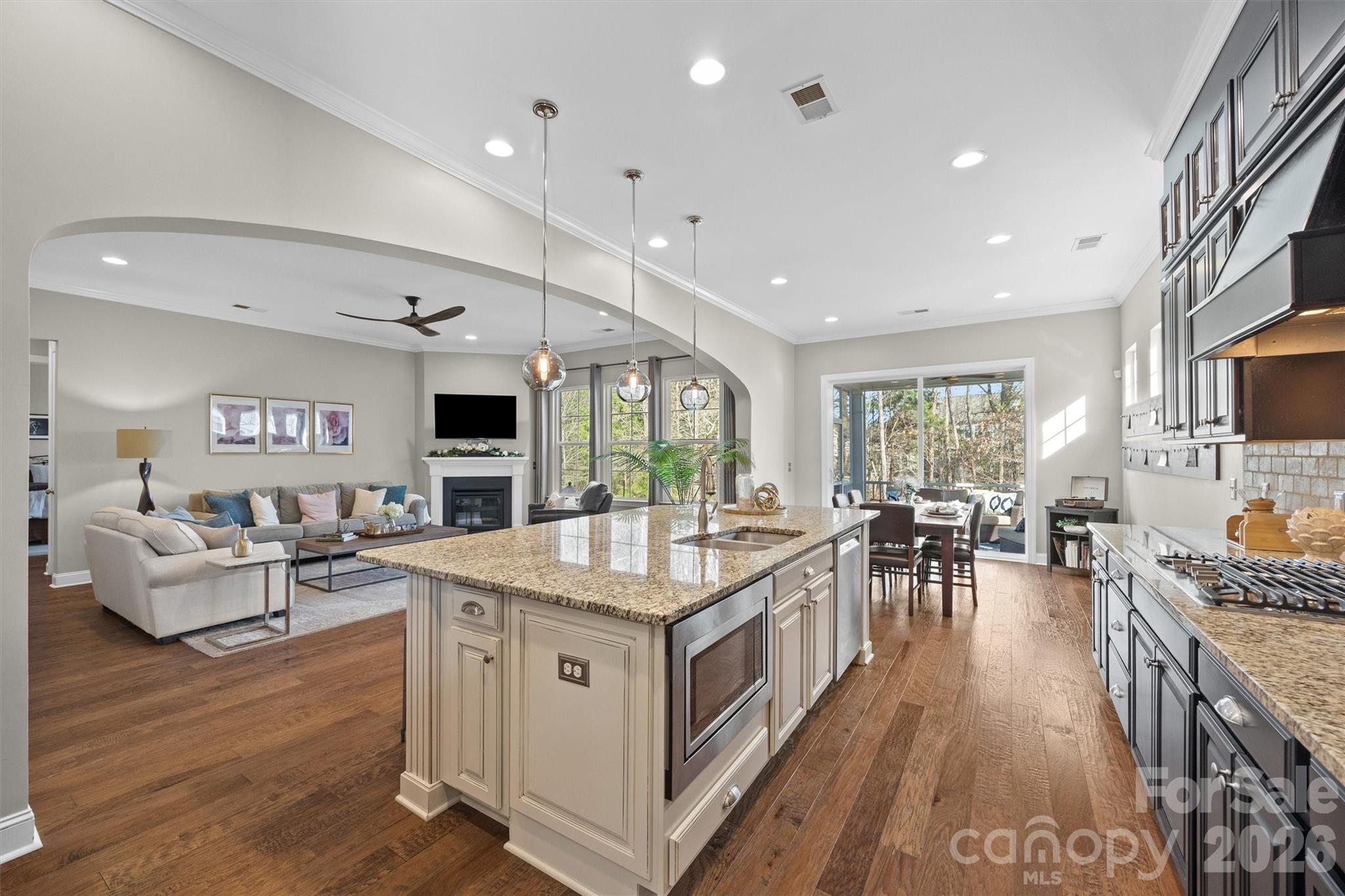 954 Castlewatch Drive Fort Mill, SC 29708 - Photo 12 of 45 a open kitchen with stainless steel appliances granite countertop a stove oven and a view of living room